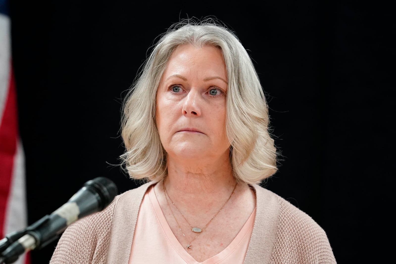 Karen Price sister of Ted Price takes a moment as she speaks about the execution of Aaron Brian Gunches at the Arizona State Prison Wednesday, March 19, 2025 in Florence, Ariz. (AP Photo/Darryl Webb)