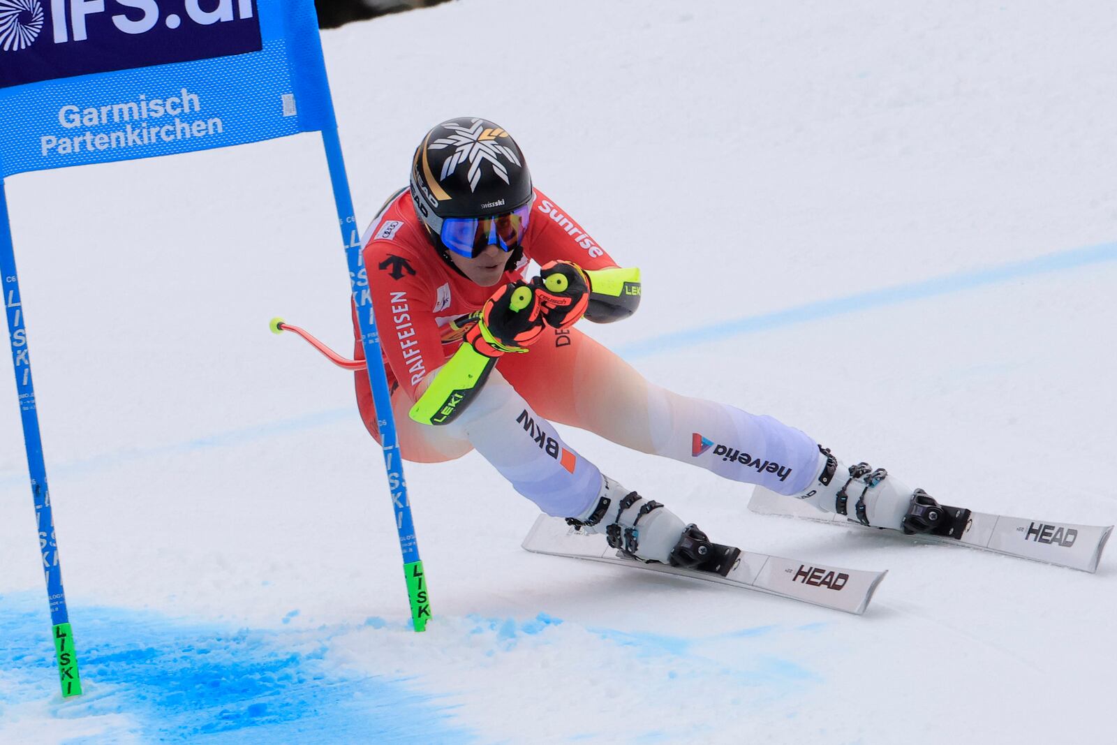 Switzerland's Lara Gut Behrami speeds down the course during an alpine ski, women's World Cup super G, in Garmisch, Germany, Sunday, Jan. 26, 2025. (AP Photo/Giovanni Maria Pizzato)