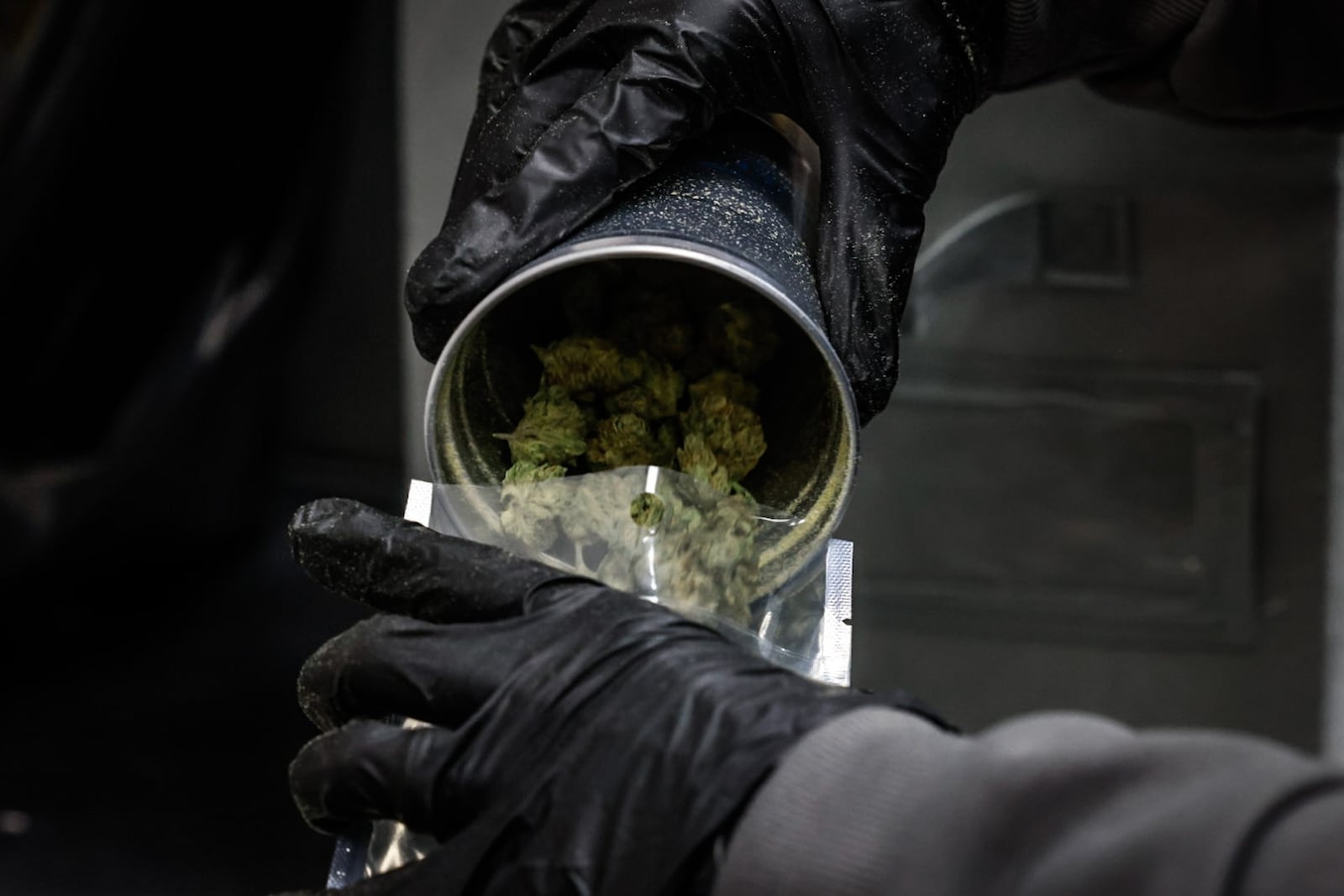 Recreational marijuana is processed and packaged in a back room at Amazing Budz in Adrian, Michigan. JIM NOELKER/STAFF