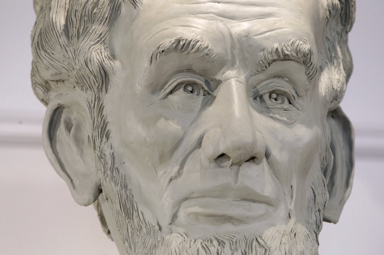 Artist Mike Major has created a sculpture of Abraham Lincoln at his studio in Urbana. The statue will be dedicated on the Dayton VA Medical Center campus on Memorial Day weekend. Lincoln’s wavy hair, thick eye brows and beard are instantly recognizable. The creases along his forehead capture the uneasiness of guiding the nation through the Civil War. LISA POWELL / STAFF