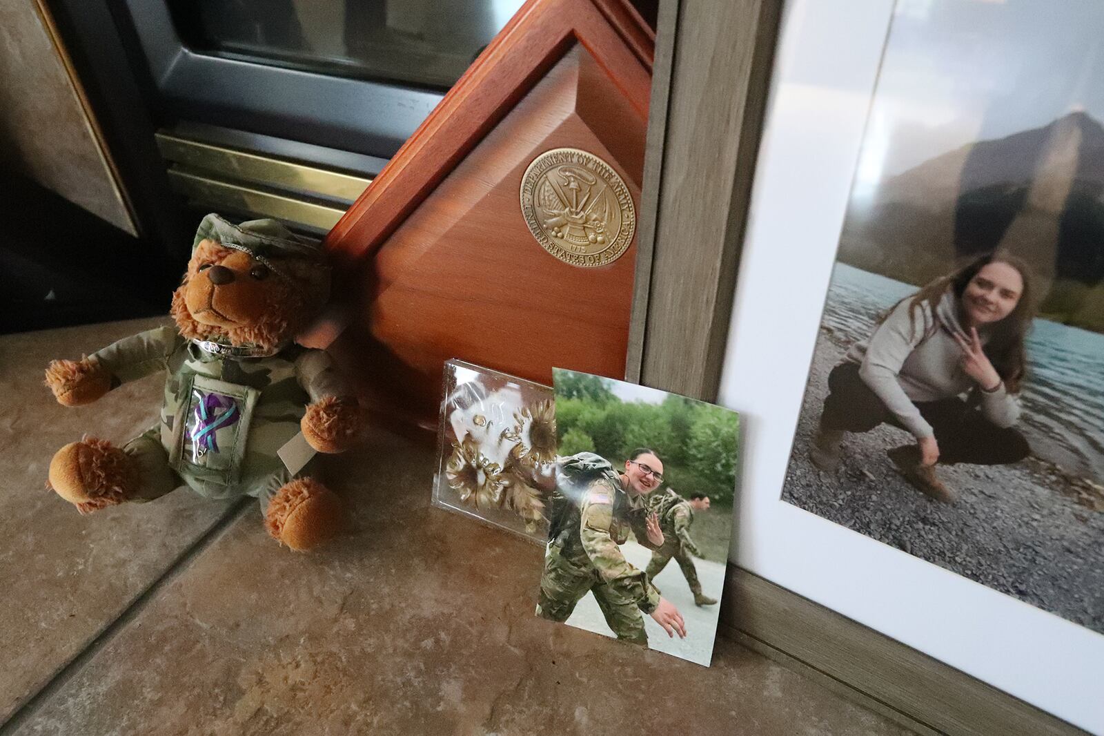 Pictures of Kaylie Harris and a small bear given to her by her family. BILL LACKEY/STAFF