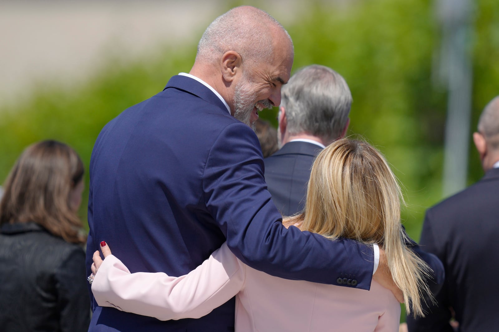 FILE - Albania's Prime Minister Edi Rama, left, walks with his arm around Italy's Prime Minister Giorgia Meloni after a group photo during the European Political Community Summit at the Mimi Castle in Bulboaca, Moldova, on June 1, 2023. Italy's government on Friday, Oct. 11, 2024 formally opened two centers in Albania where it plans to process male migrants who are intercepted in international waters. (AP Photo/Vadim Ghirda, File)