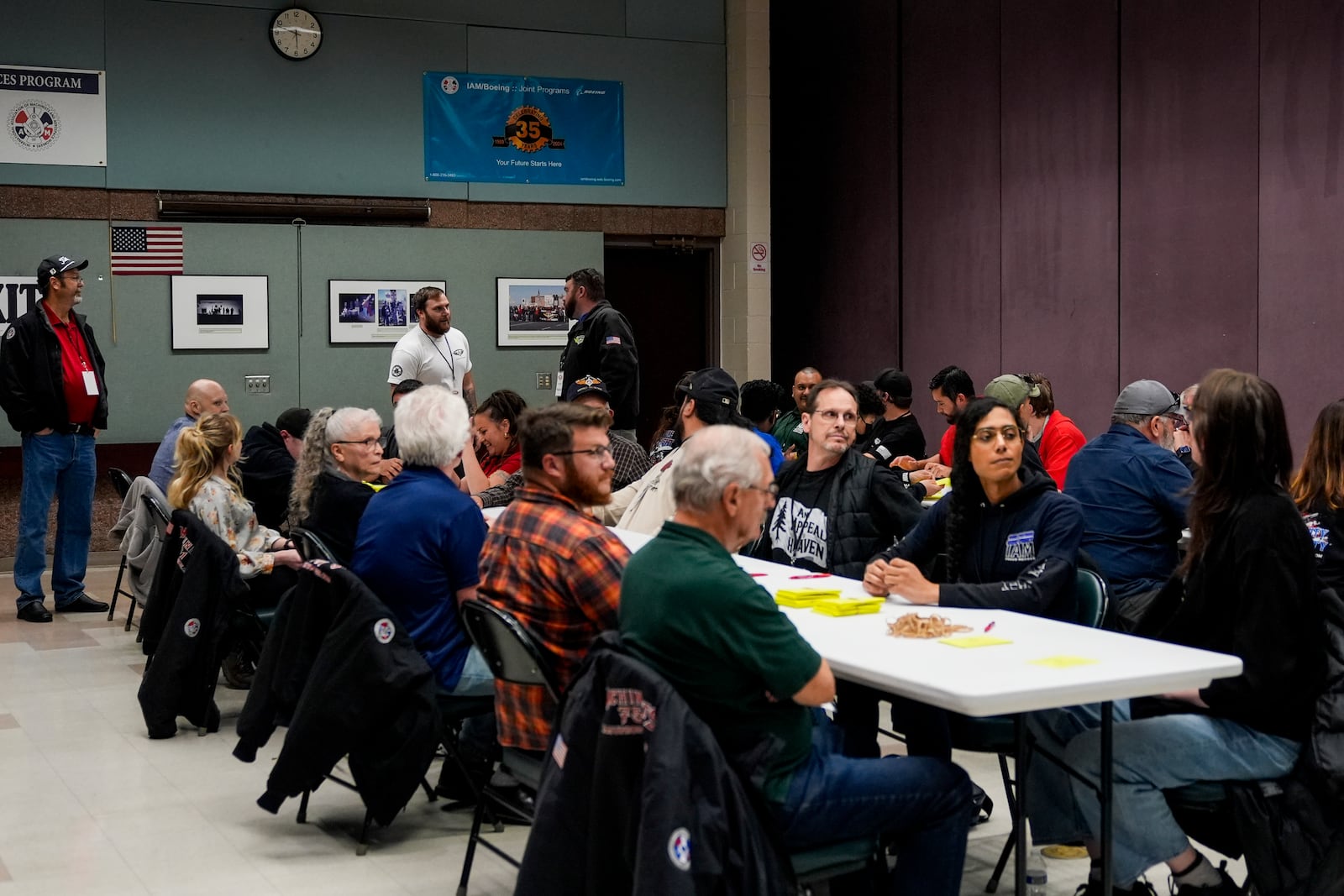 Volunteers tally votes on a new contract offer from Boeing, Wednesday, Oct. 23, 2024, at Seattle Union Hall in Seattle. (AP Photo/Lindsey Wasson)