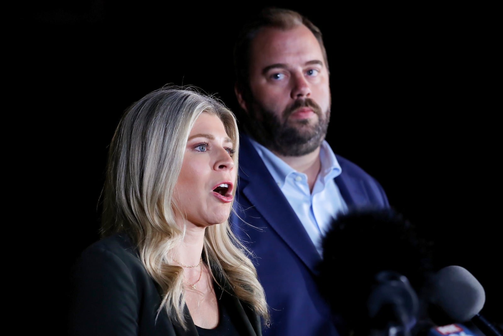 Texas state representatives Lacey Hull, left, and John Bucy III comment during a press conference after the stay granted by the Texas Supreme Court to halt the execution of Robert Roberson, at the Huntsville Unit of the Texas State Penitentiary, Thursday, Oct. 17, 2024, in Huntsville, Texas. (AP Photo/Michael Wyke)