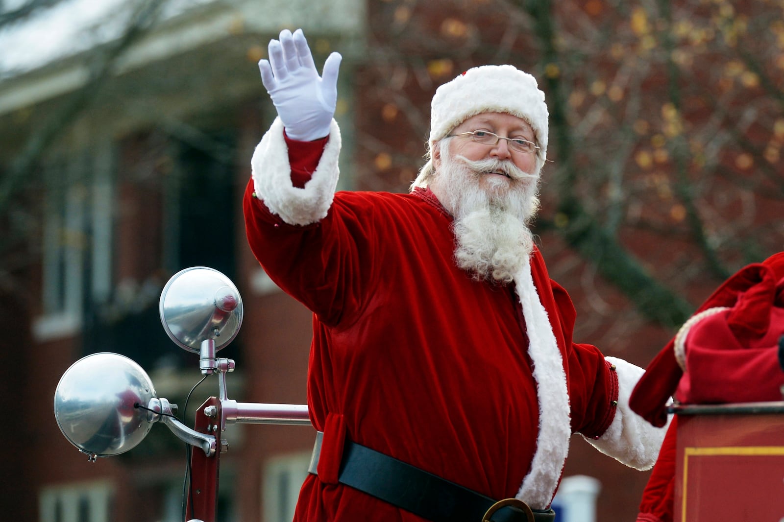 FILE - Santa Claus makes an appearance Saturday, Dec. 7, 2024, in downtown St. Joseph, Mich., during the annual Reindog Parade. (Don Campbell/The Herald-Palladium via AP, File)