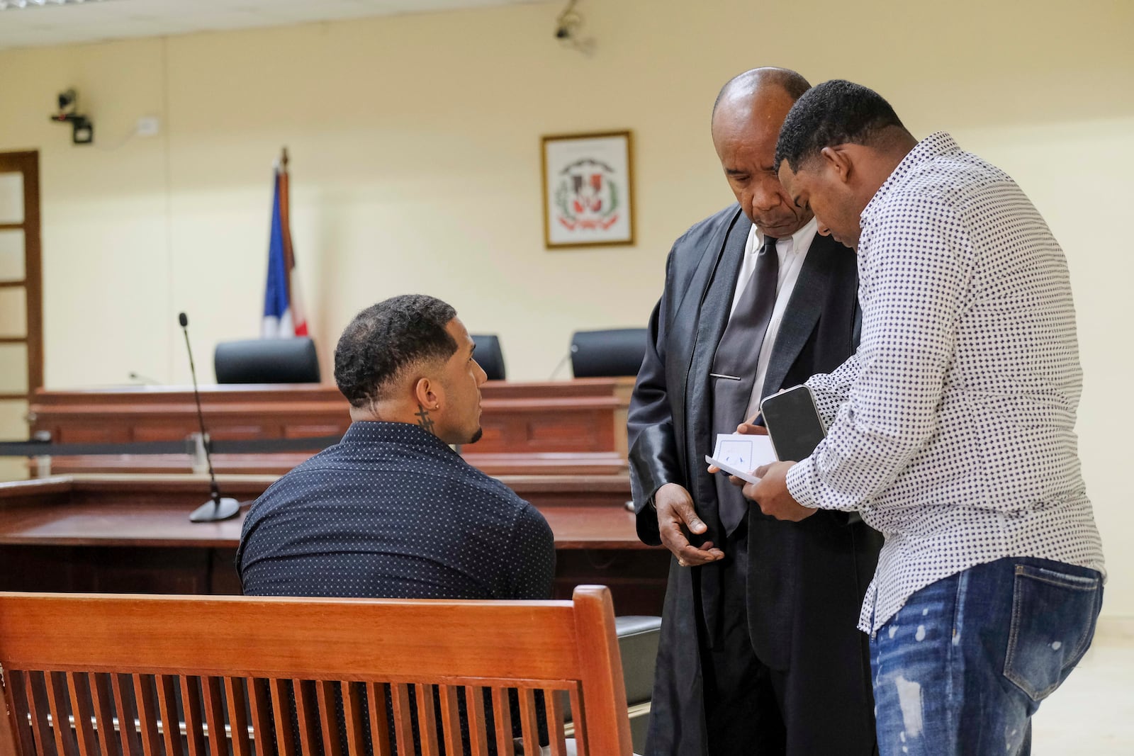 Tampa Bay Rays shortstop Wander Franco, left, attends his trial on charges of sexually abusing a minor, sexual and commercial exploitation against a minor and human trafficking, accompanied by his lawyer Teodosio Jaquez, center, in Puerto Plata, Dominican Republic, Thursday, Dec. 12, 2024. (AP Photo/Ricardo Hernandez)