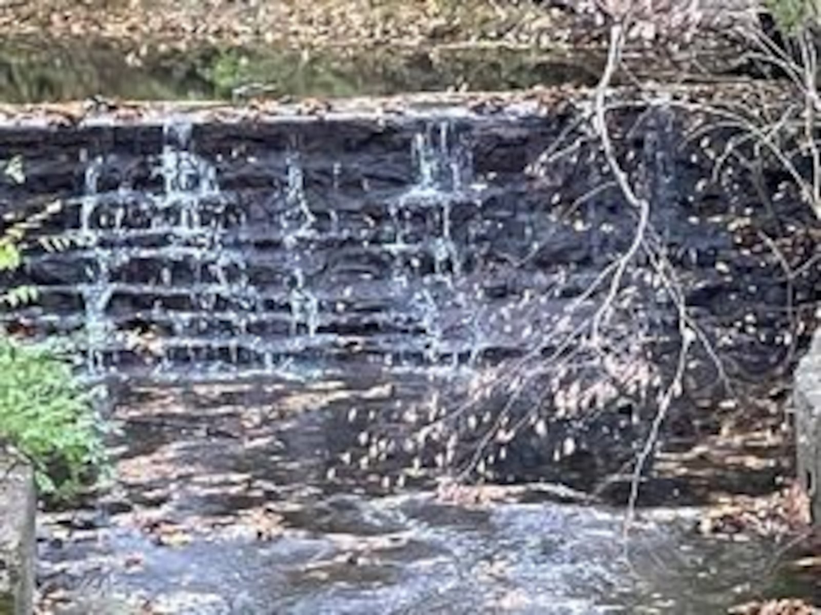 Visible from the road, this dam was partially chiseled from the bedrock. PAM COTTREL