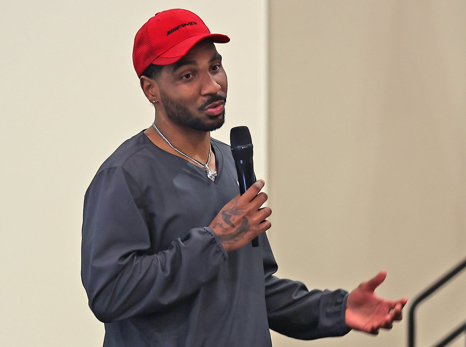 Springfield native and former Ohio State quarterback Braxton Miller talks to the Springfield Rotary Club about helping local kids through the The Braxton Miller Foundation Monday. BILL LACKEY/STAFF