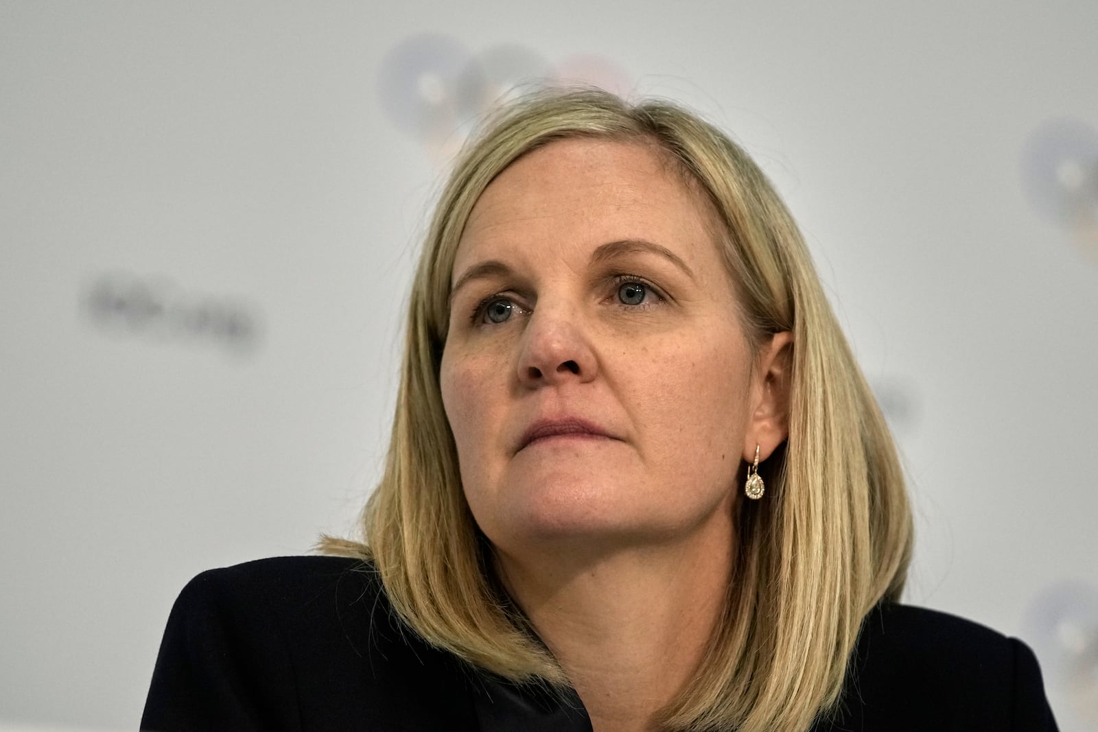 Kirsty Coventry listens a question during a press conference after she was elected as the new IOC President at the International Olympic Committee 144th session in Costa Navarino, western Greece, Thursday, March 20, 2025. (AP Photo/Thanassis Stavrakis)