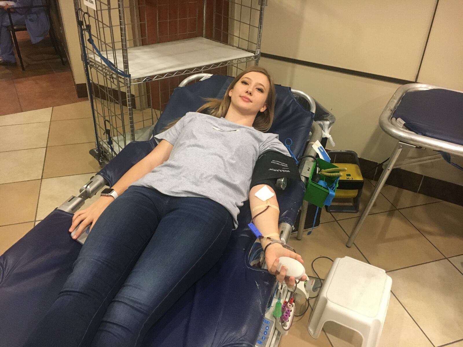 Lainey Phillips, 16, a junior at Edgewood High School, co-sponsored a community blood drive last week at Atrium Medical Center. Lainey and her parents, Larry and Cindy, gave blood in honor of Logan Phillips, who died nearly 15 years ago from hemophagocytic lymphohistiocytosis (HLH), a condition in which the body makes too many activated immune cells. RICK McCRABB/STAFF