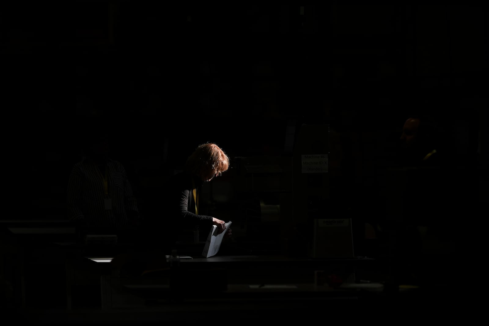 An election worker processes mail-in ballots for the 2024 General Election at the Philadelphia Election Warehouse, Tuesday, Nov. 5, 2024, in Philadelphia. (AP Photo/Matt Slocum)