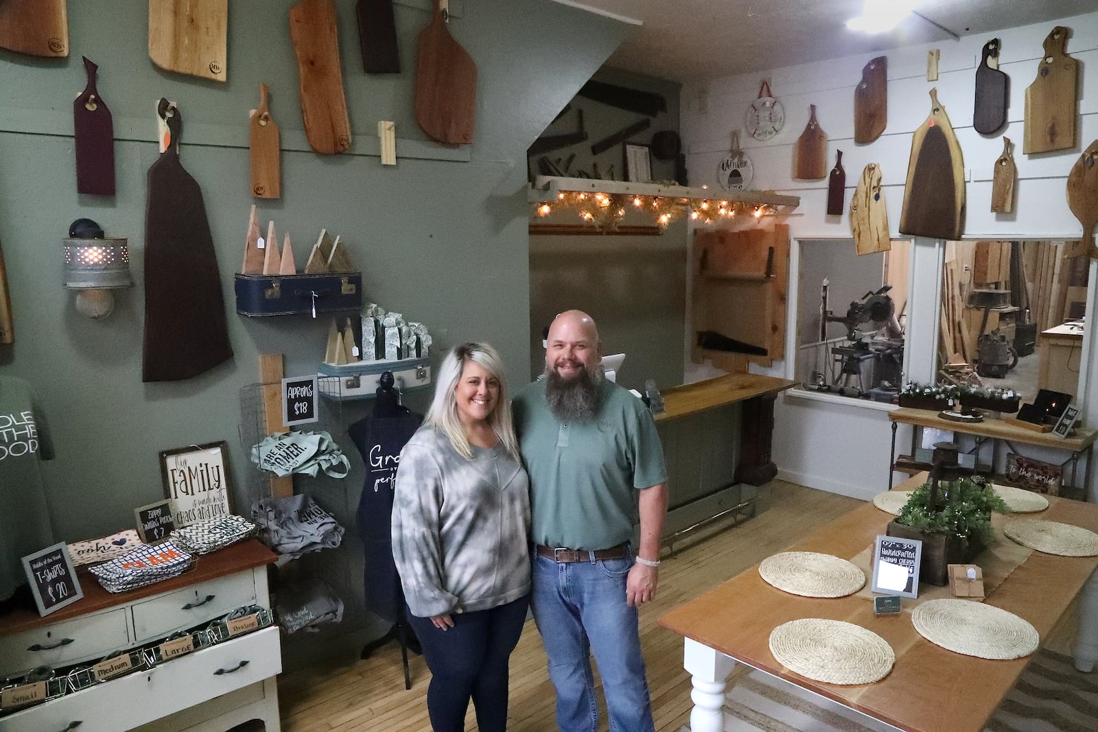 Andy Mitterholzer and his wife, Margaret, owners of Middle of the Wood, at 231 N. Main St. in Urbana Wednesday, Oct. 26, 2022. BILL LACKEY/STAFF