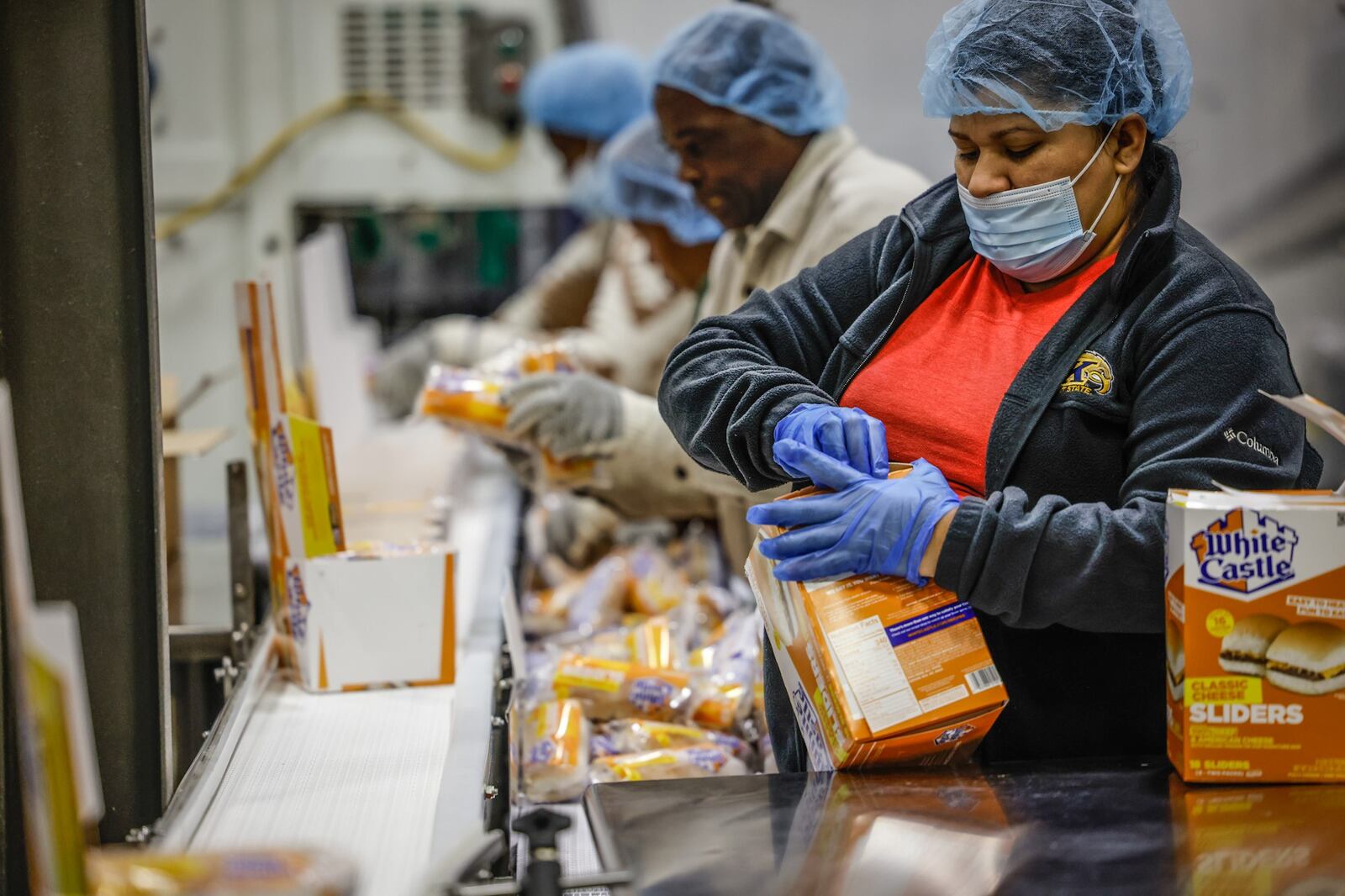 Works at the White Castle Vandalia plant box-up over a million hamburgers at day. JIM NOELKER/STAFF