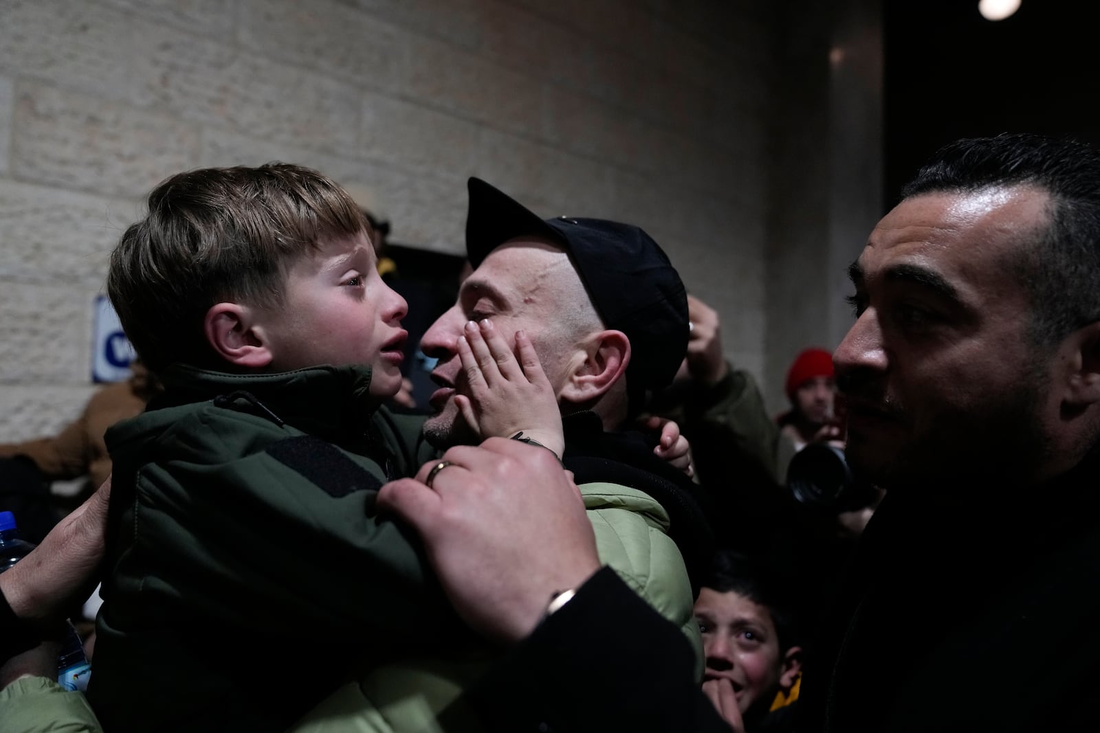 Palestinian prisoners are greeted after being released from Israeli prison following a ceasefire agreement between Israel and Hamas, in the West Bank city of Ramallah, Thursday, Feb. 27, 2025. (AP Photo/Nasser Nasser)