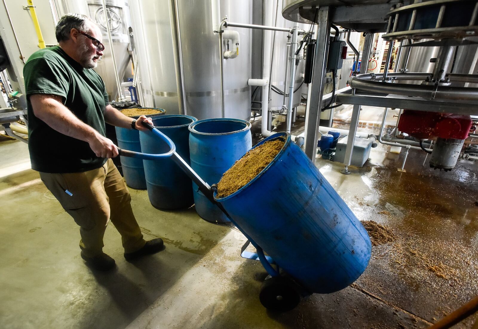 Head brewer Fred Pallent cleans up to make a new batch of beer at Warped Wing Brewing Company Thursday, Dec. 19, 2019 on Wyandot Street in Dayton. NICK GRAHAM/STAFF