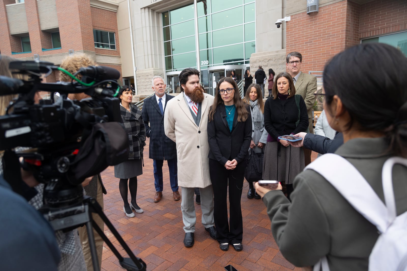 FILE - Jennifer Adkins and her husband, John, from Caldwell, Idaho talk to the media outside the Ada County Courthouse, Dec. 14, 2023, in Boise, Idaho. (AP Photo/Kyle Green, File)