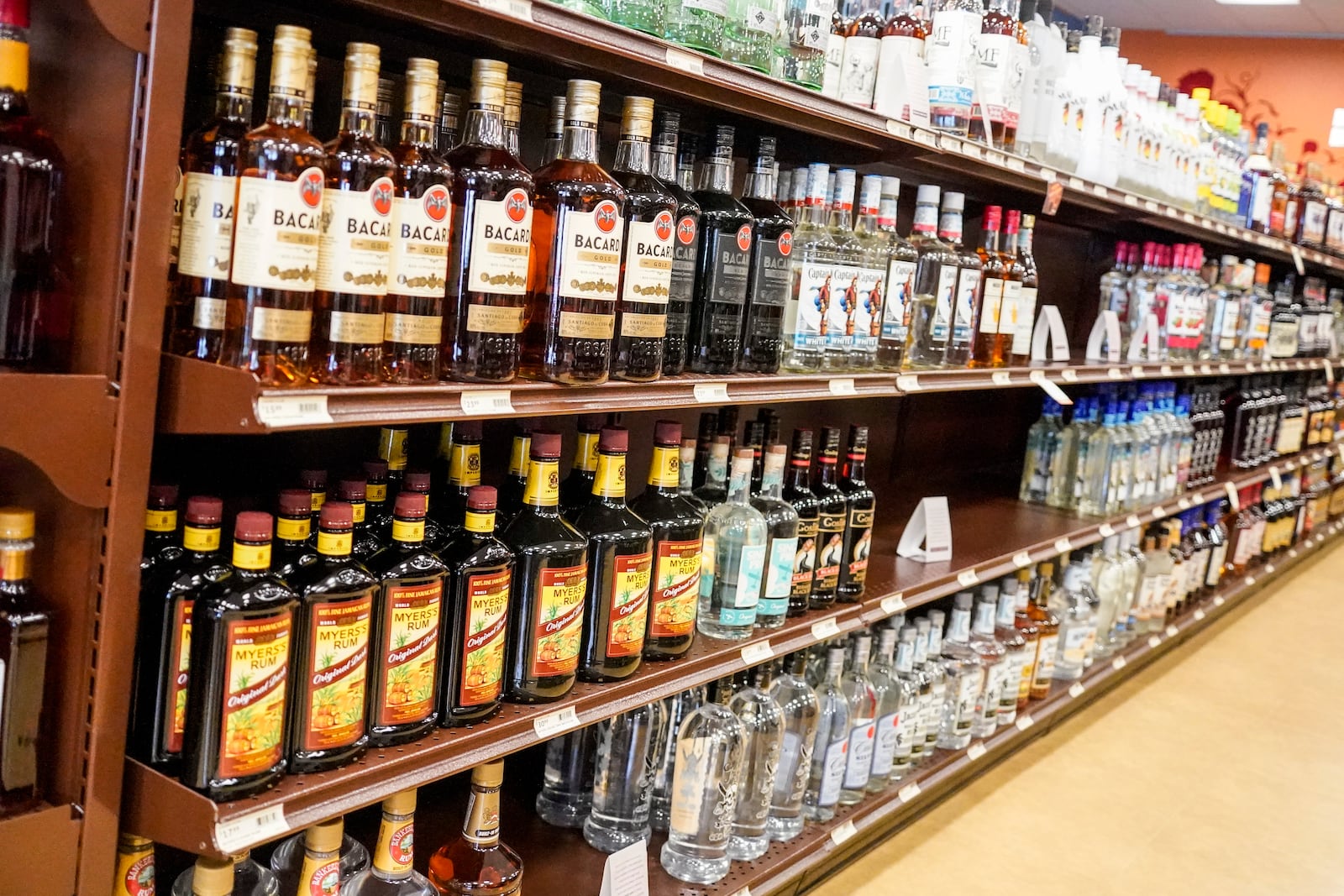 FILE - Shelves display bottles of rums for sale at a Pennsylvania fine wine and spirits store, Saturday, Jan. 22, 2022, in Harmony, Pa. (AP Photo/Keith Srakocic, File)