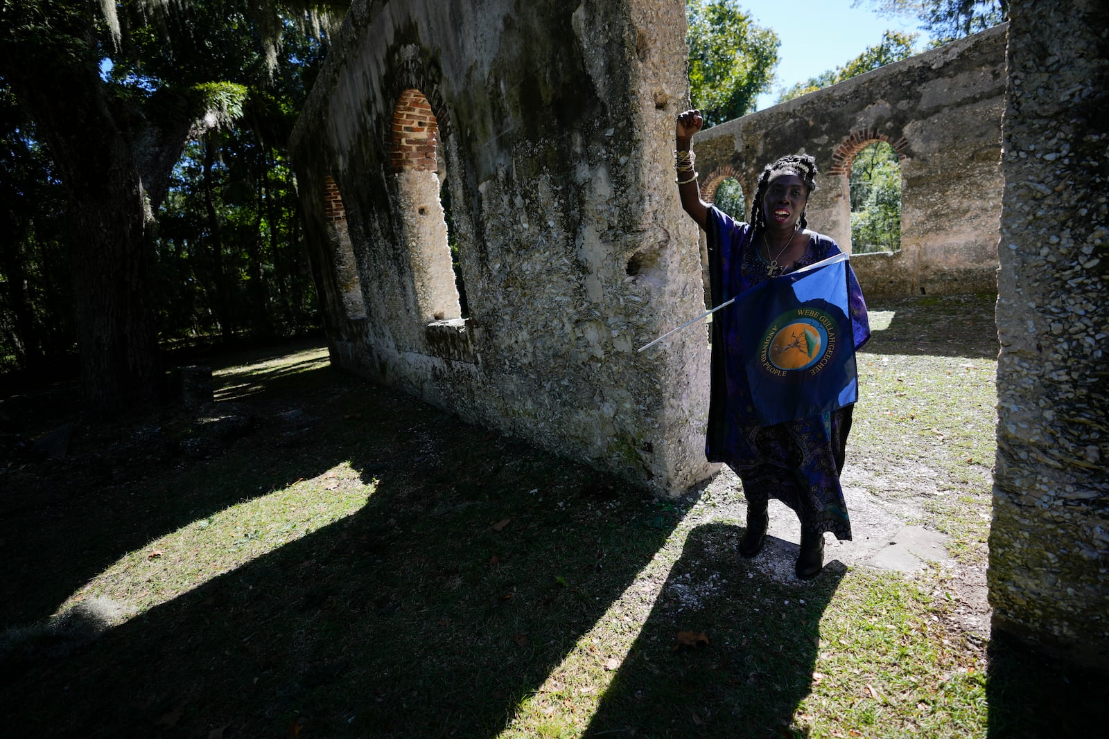 FILE - Marquetta Goodwine, a local community leader who is also known as "Queen Quet", speaks to Associated Press journalists about Gullah Geechee history, at the ruins of the Chapel of Ease, where plantation owning families would attend church services, on St. Helena Island, S.C., on Oct. 29, 2021. (AP Photo/Rebecca Blackwell, File)