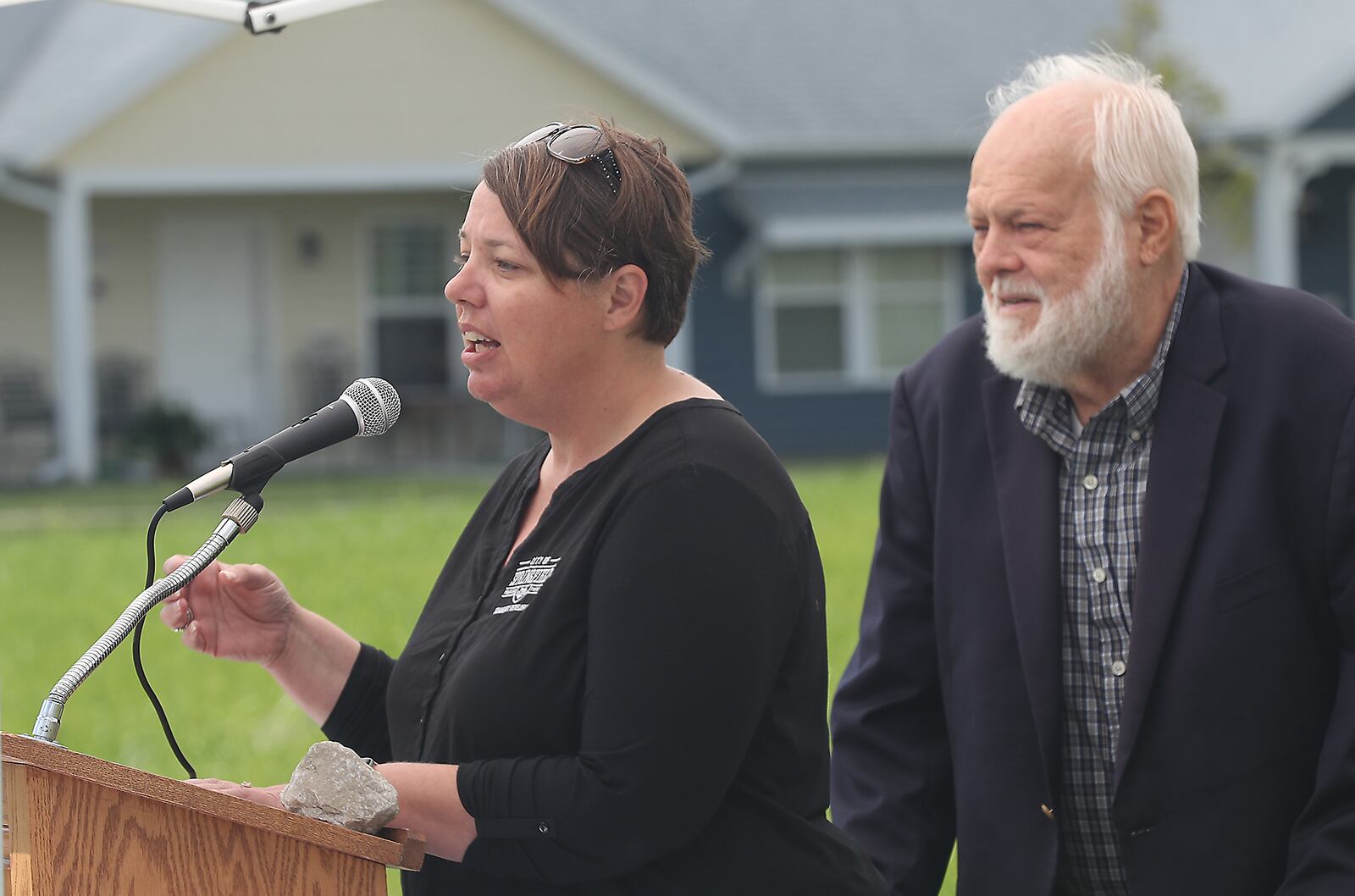 The City of Springfield's Mayor Warren Copeland and Shannon Meadows speak during the groundbreaking celebration for the next phase of The Community Gardens development Tuesday, Sept. 13, 2022. BILL LACKEY/STAFF