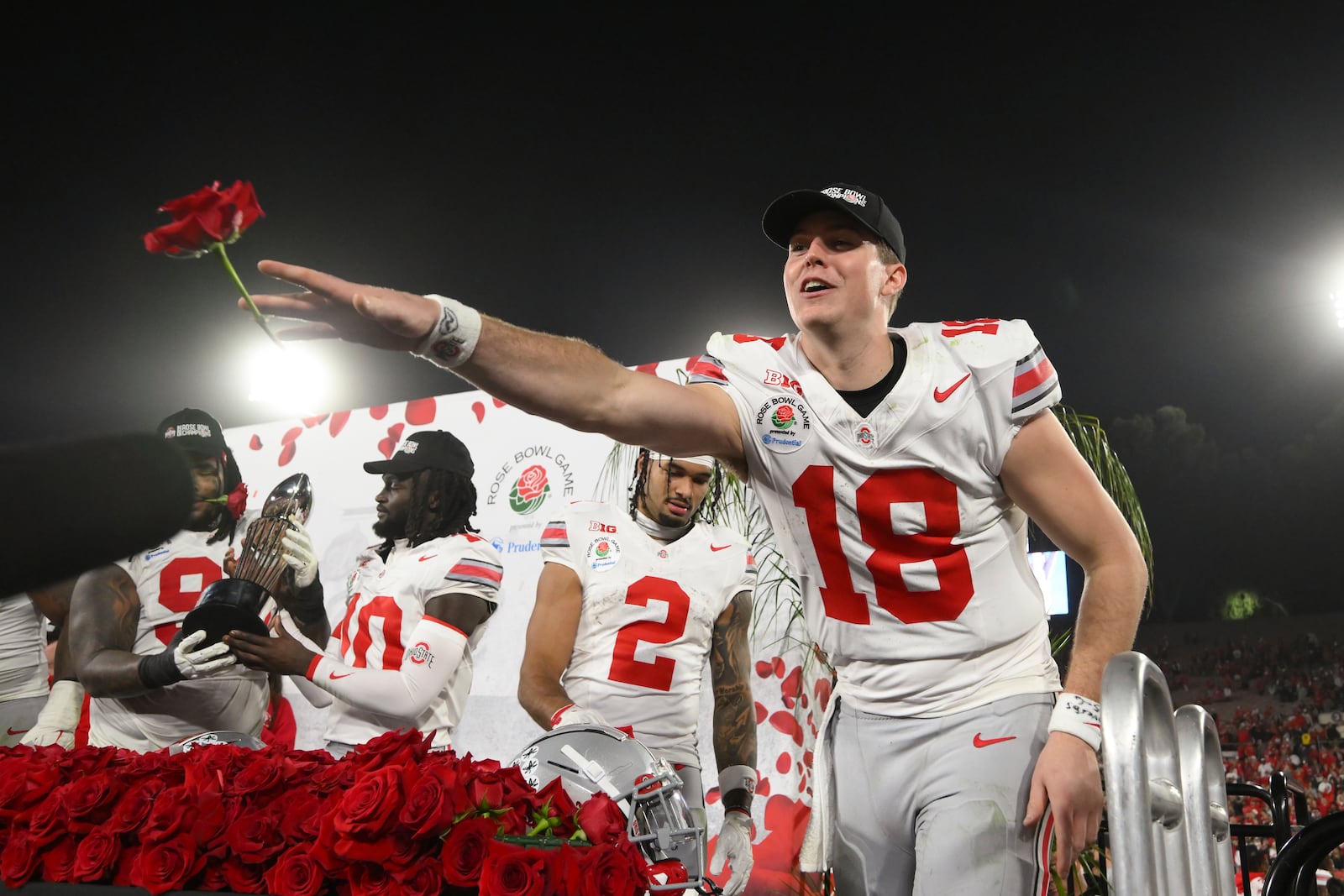 Ohio State quarterback Will Howard (18) throws a rose into the crowd after the quarterfinals of the Rose Bowl College Football Playoff against Oregon, Wednesday, Jan. 1, 2025, in Pasadena, Calif. (AP Photo/Kyusung Gong)