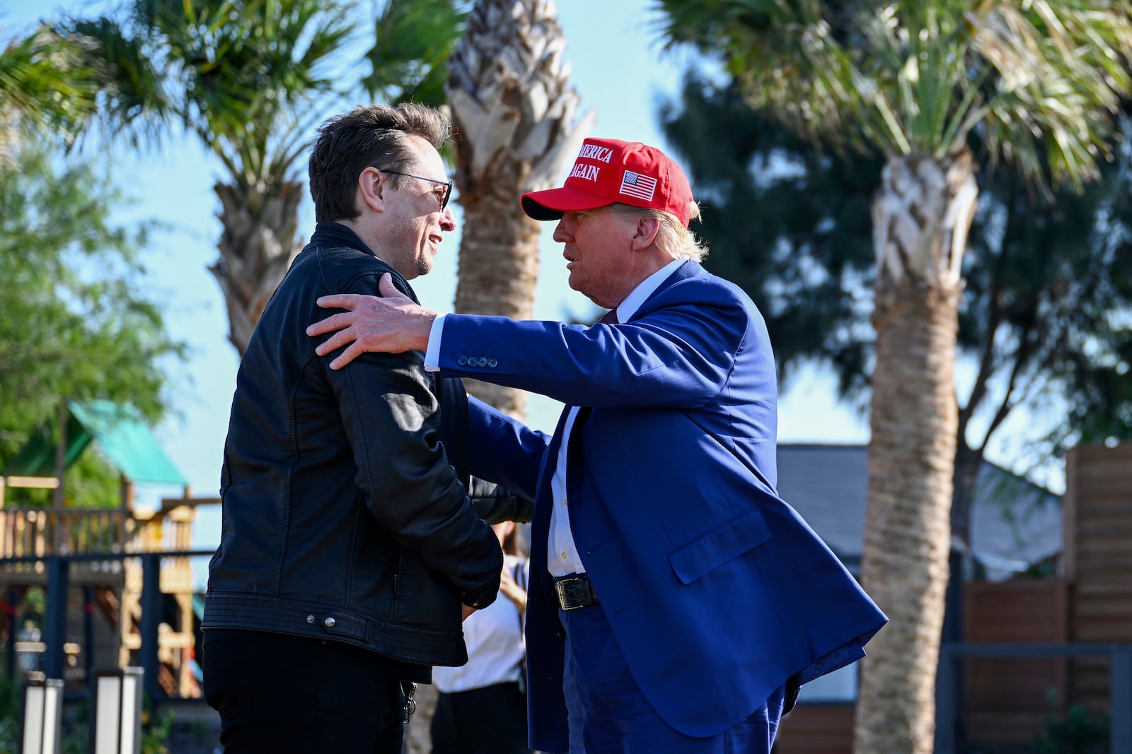 President-elect Donald Trump greets Elon Musk before the launch of the sixth test flight of the SpaceX Starship rocket Tuesday, Nov. 19, 2024 in Brownsville, Texas. (Brandon Bell/Pool via AP)