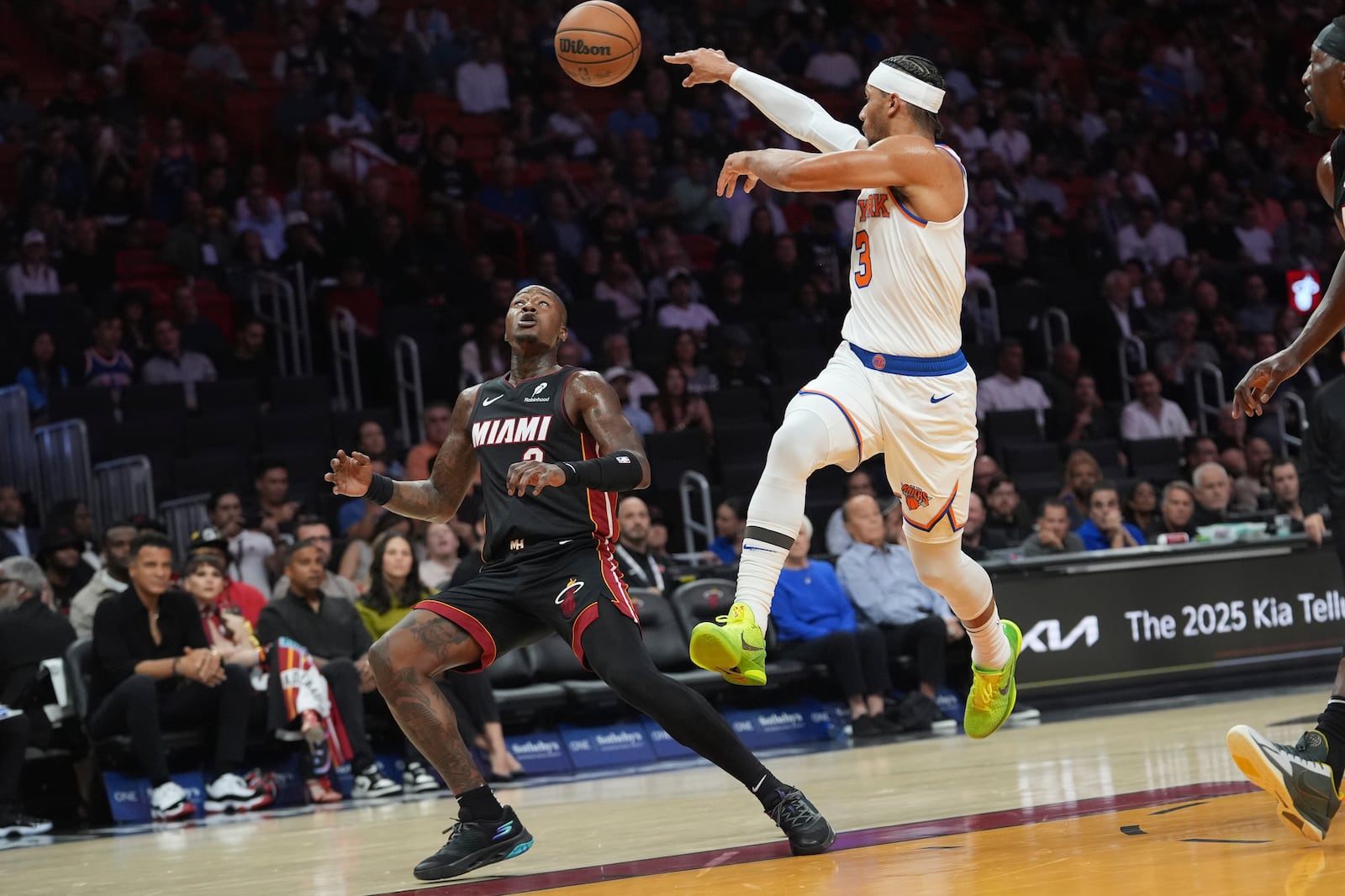 New York Knicks guard Josh Hart (3) passes the ball over Miami Heat guard Terry Rozier (2) during the first half of an NBA basketball game, Wednesday, Oct. 30, 2024, in Miami. (AP Photo/Lynne Sladky)