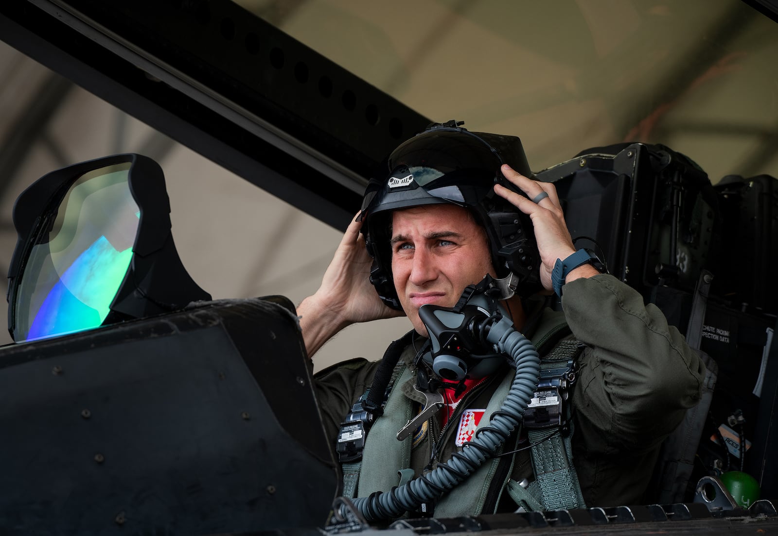 Maj. Brett Gedman, 301st Fighter Squadron pilot, adjusts his Next Generation Fixed Wing Helmet prior to an F-22A Raptor mission March 24, 2022, at Eglin Air Force Base, Fla. (U.S. Air Force photo by Samuel King Jr.)