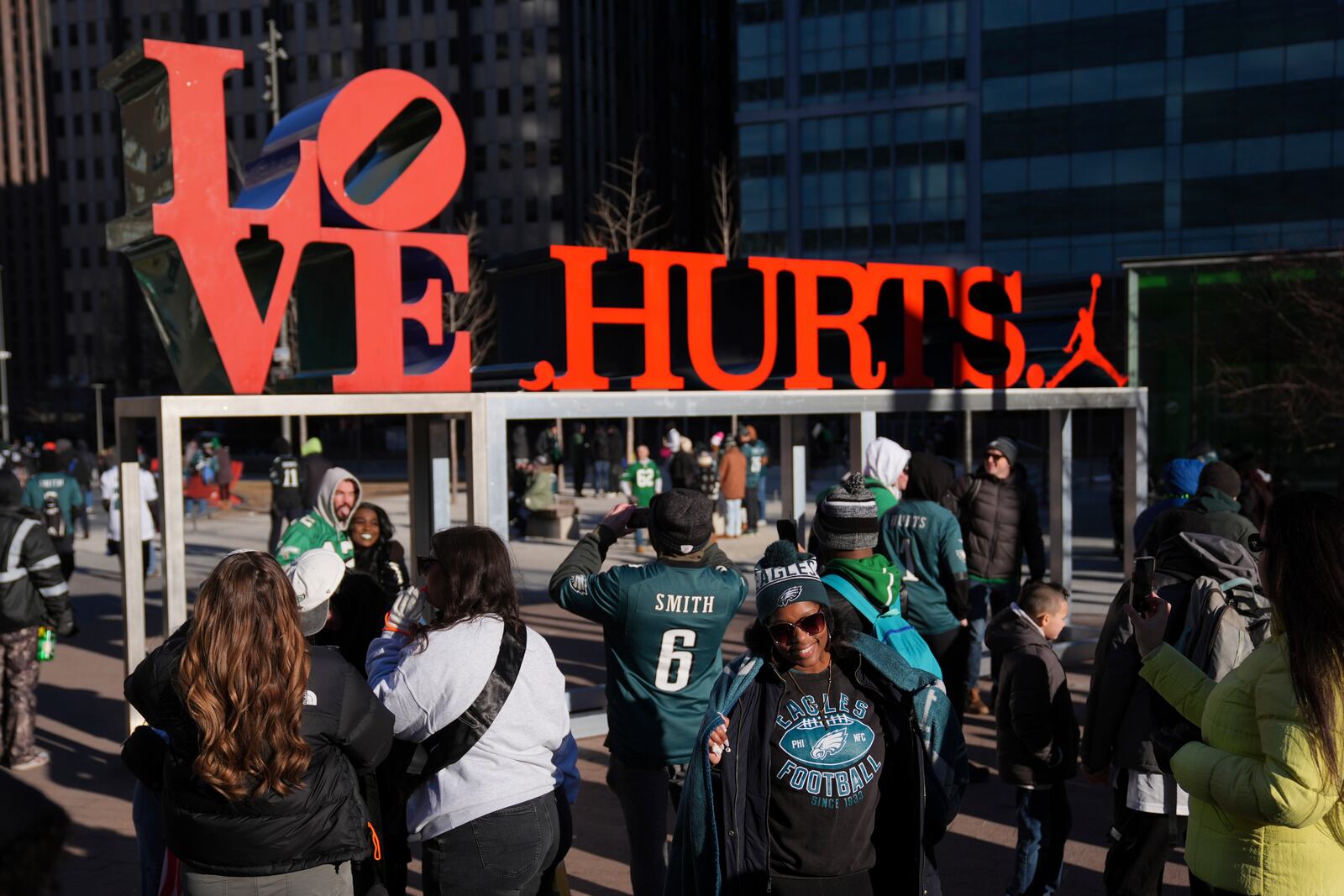 Fans take pictures as they arrive before the Philadelphia Eagles NFL football Super Bowl 59 parade and celebration, Friday, Feb. 14, 2025, in Philadelphia. (AP Photo/Matt Rourke)