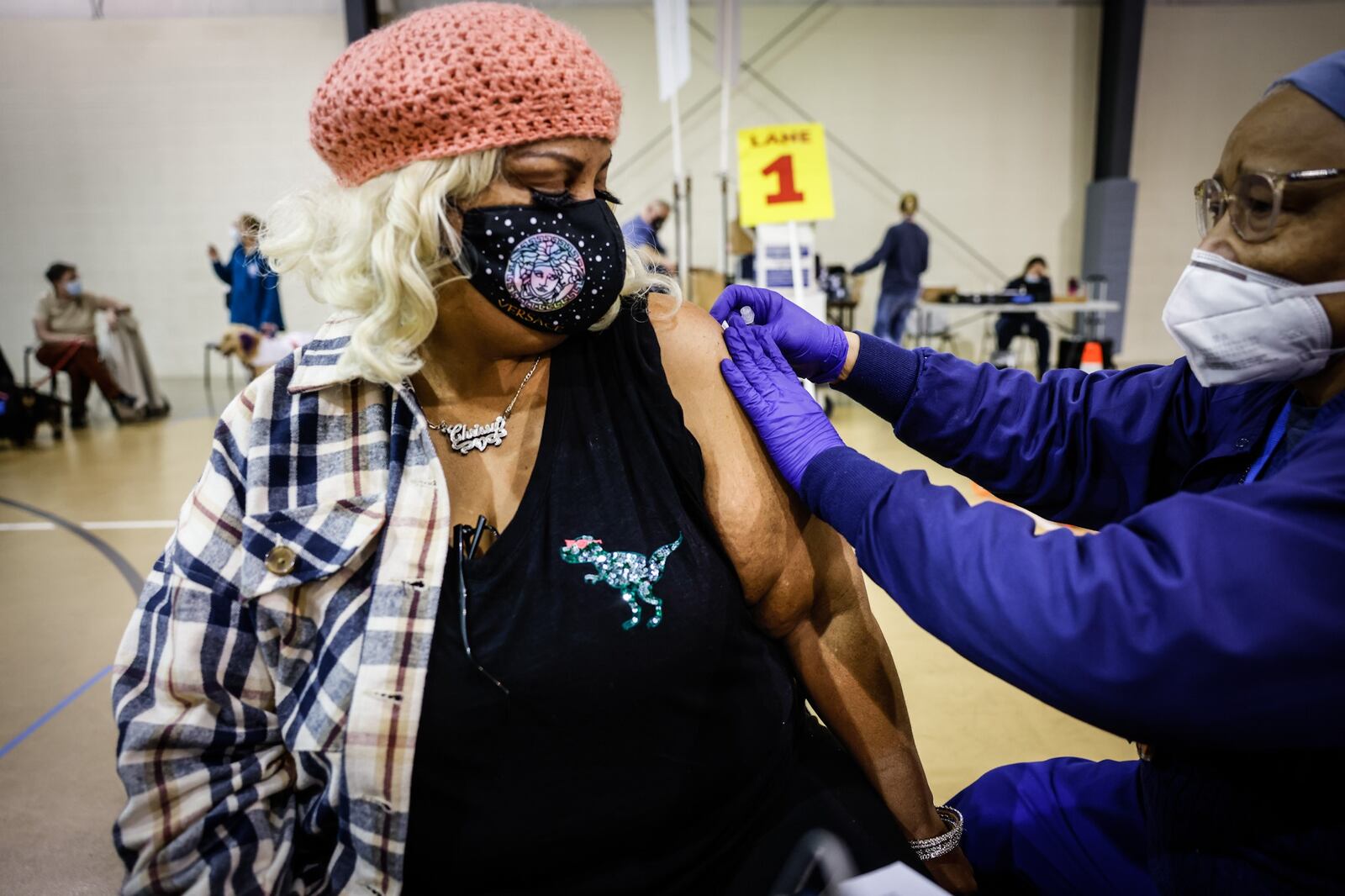 Christina Marshall, from Dayton, gets her COVID-19 booster shot at a Montgomery County Health vaccine clinic at Bethesda Temple Wednesday Feb. 16, 2022. JIM NOELKER/STAFF