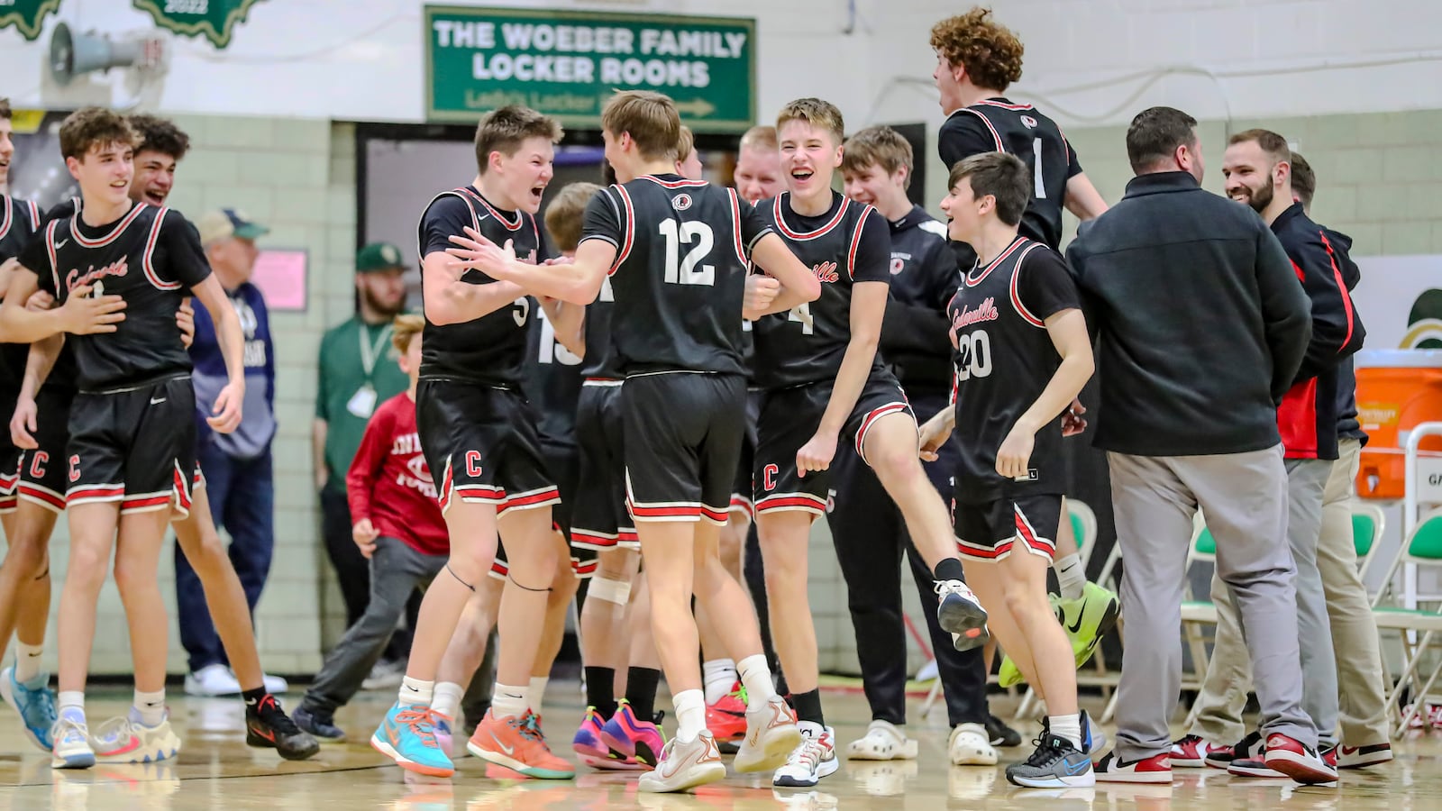 The Cedarville High School boys basketball team celebrates after beating Catholic Central 50-44 on Friday, Feb. 14 at Jason Collier Gymnasium in Springfield. With the victory, the Indians earned a share of the Ohio Heritage Conference South Division title. MICHAEL COOPER/CONTRIBUTED