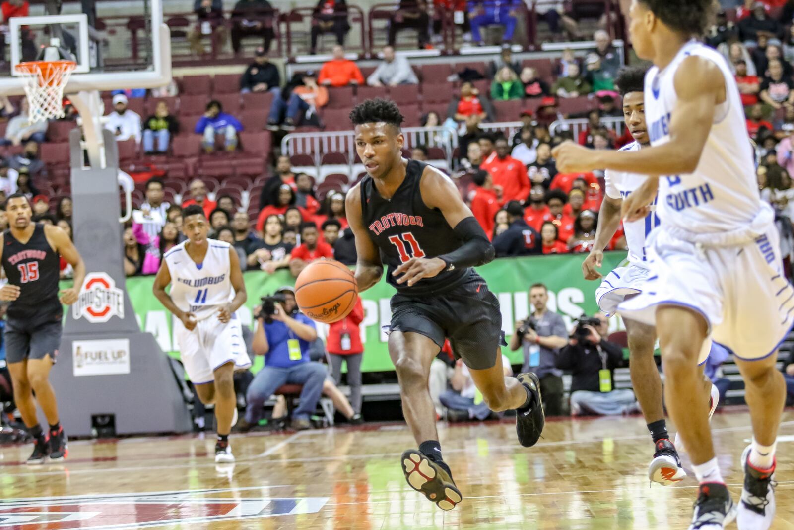 Trotwood-Madison High School junior Carl Blanton dribbles the basketball up the floor during the Division II state championship game against Columbus South on Saturday afternoon at Ohio State University's Jerome Schottenstein Center.