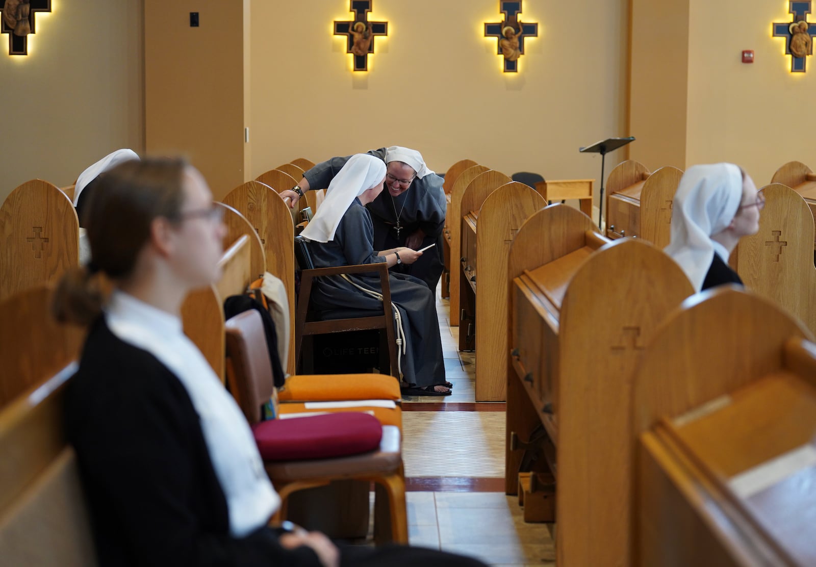 Sisters of the order, Franciscan Sisters, T.O.R. of Penance of the Sorrowful Mother, talk after Mass in Toronto, Ohio, Thursday, Nov. 7, 2024. (AP Photo/Jessie Wardarski)