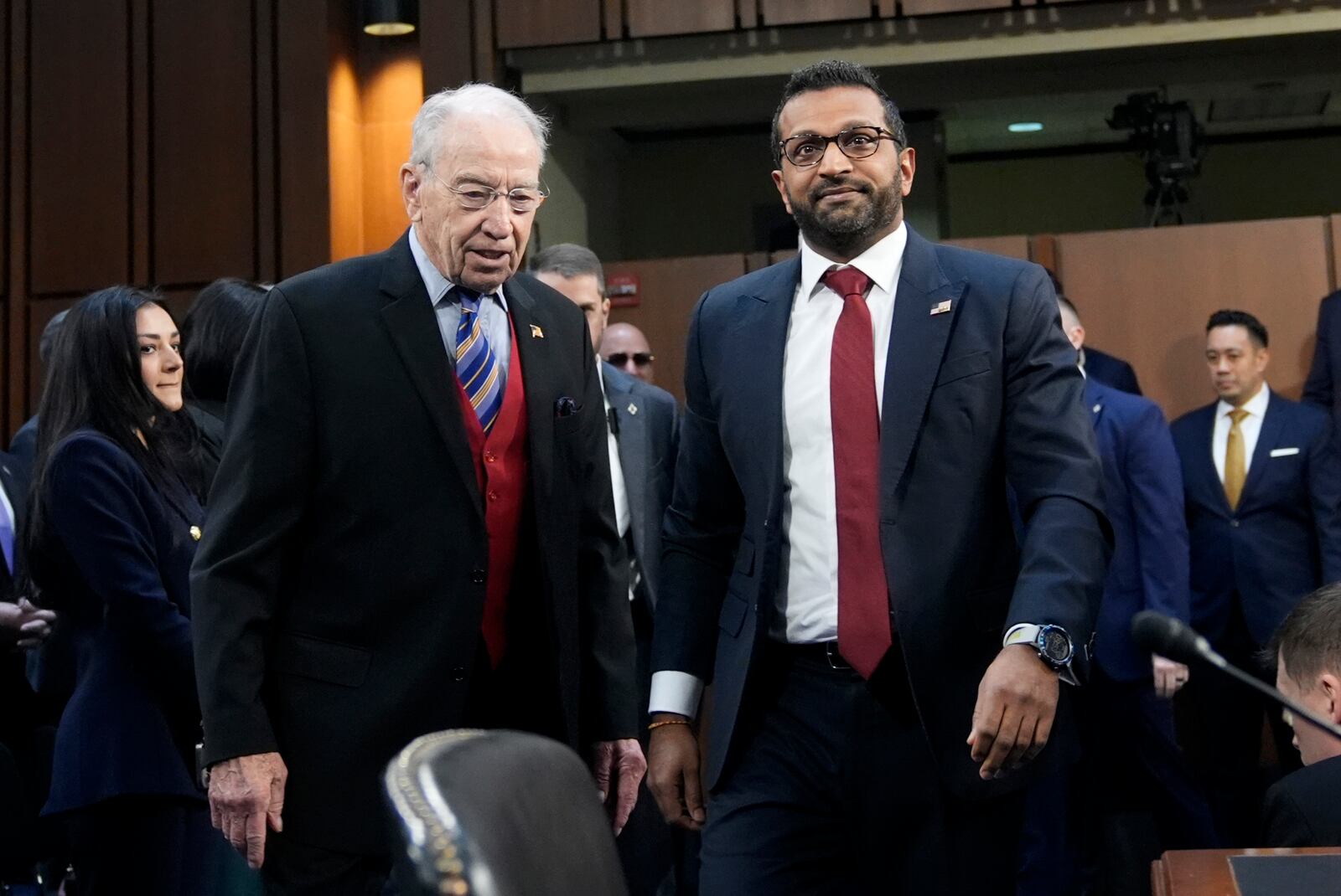 Sen. Chuck Grassley, R-Iowa, left, and Kash Patel, President Donald Trump's choice to be director of the FBI, arrive for Patel's confirmation hearing before the Senate Judiciary Committee at the Capitol in Washington, Thursday, Jan. 30, 2025. (AP Photo/J. Scott Applewhite)