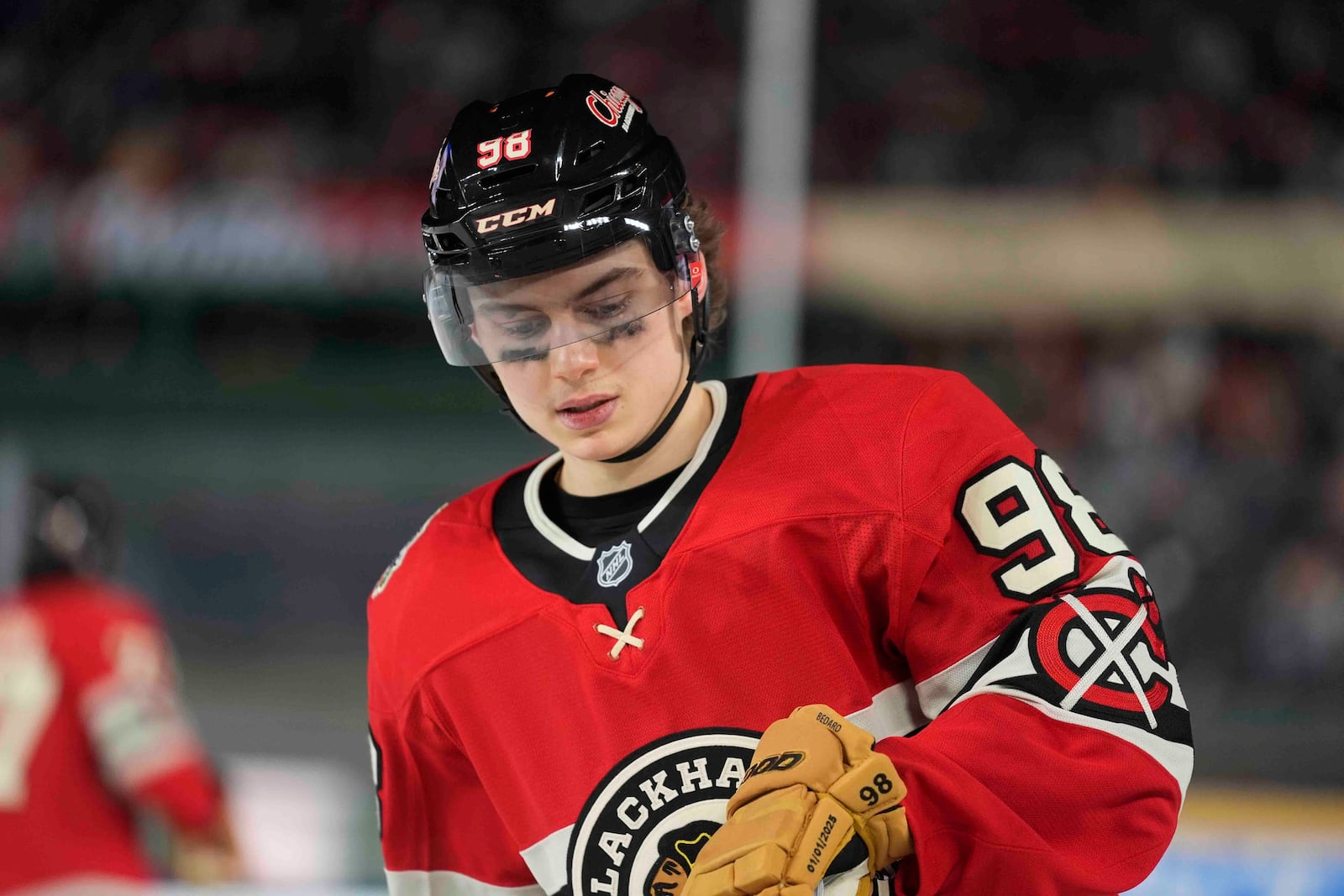 Chicago Blackhawks center Connor Bedard reacts as the St. Louis Blues score during the second period of the NHL Winter Classic outdoor hockey game at Wrigley Field, Tuesday, Dec. 31, 2024, in Chicago. (AP Photo/Erin Hooley)