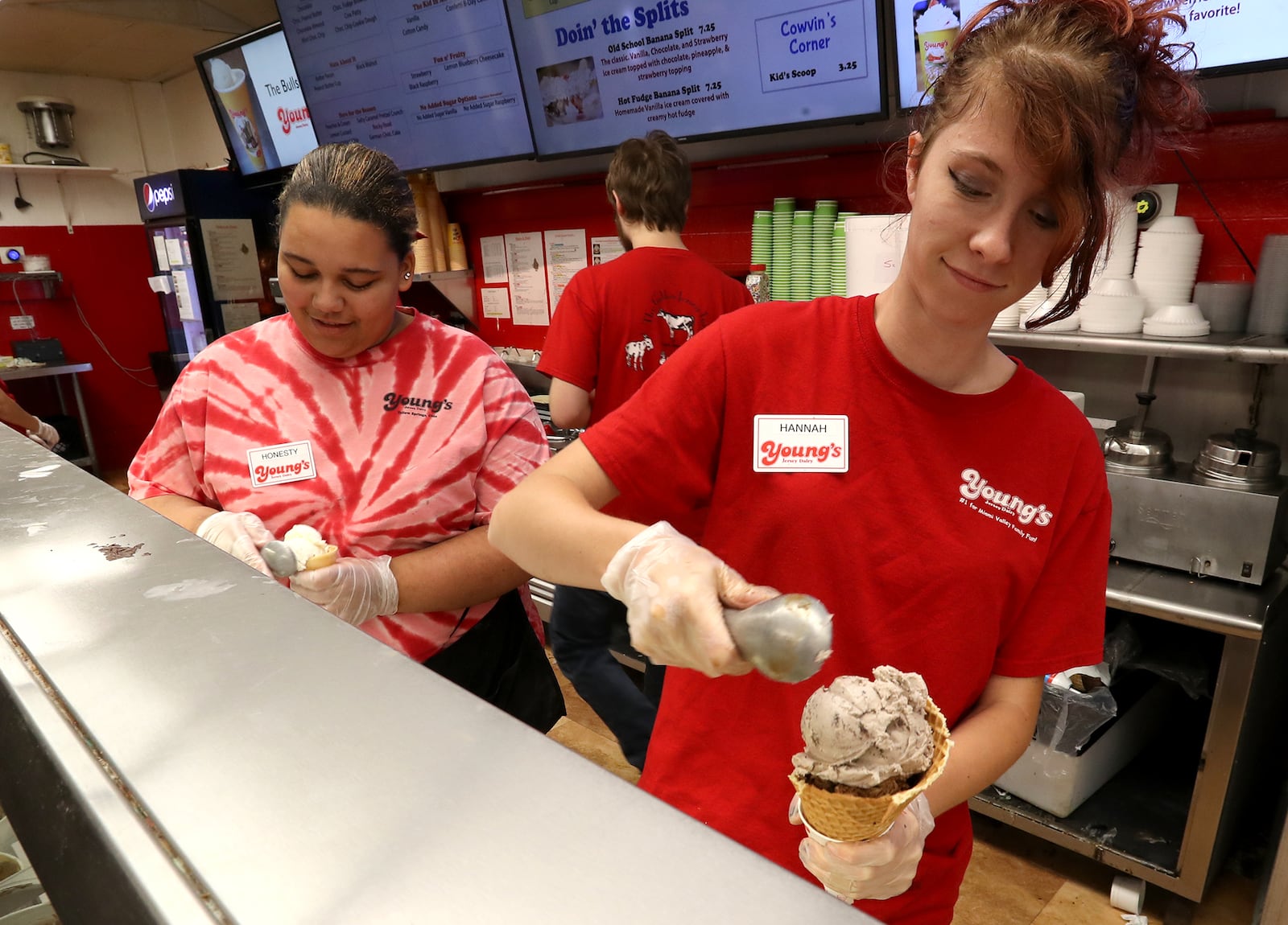 Young's Jersey Dairy employees dish up ice cream non-stop in the summer time. BILL LACKEY/STAFF