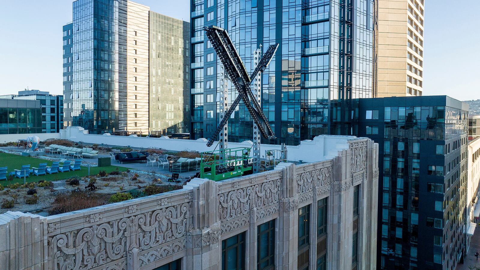 FILE - An "X" sign rests atop the company's headquarters in downtown San Francisco on July 28, 2023. (AP Photo/Noah Berger, File)