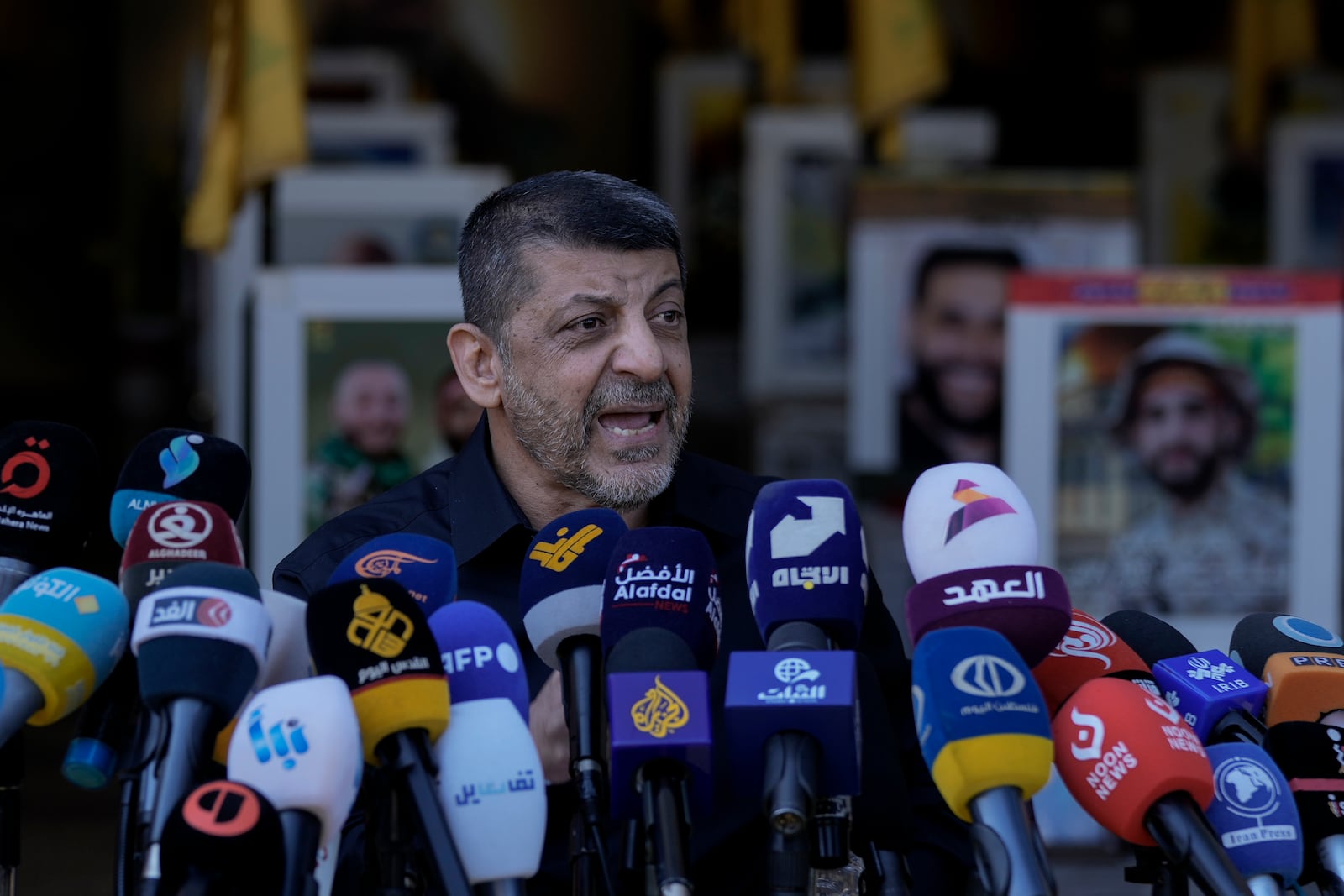 Hezbollah's chief spokesman Mohammed Afif, speaks during a press conference at the al-Hawra Zeinab cemetery in Dahiyeh, Lebanon, Tuesday, Oct. 22, 2024. (AP Photo/Bilal Hussein)