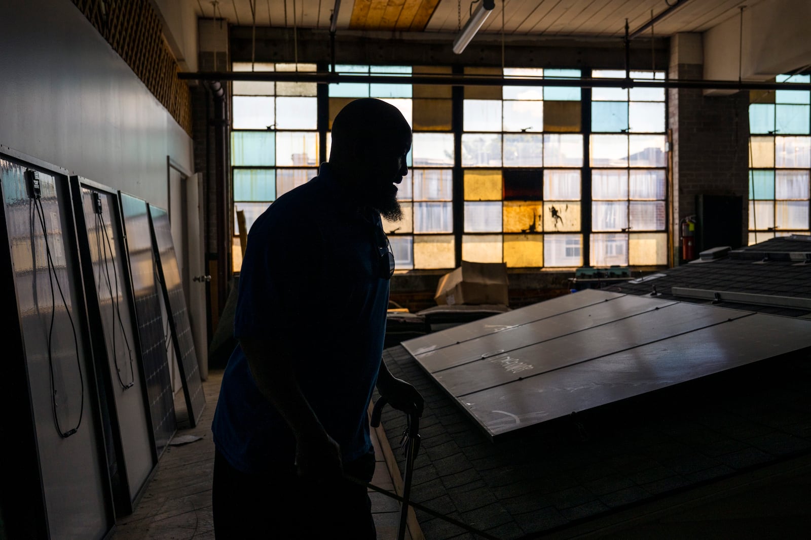 Jackie Robinson, an instructor at the Energy Coordinating Agency, a nonprofit focused in part on energy equity, works inside the facility on Tuesday, July 2, 2024 in Philadelphia. (AP Photo/Joe Lamberti)