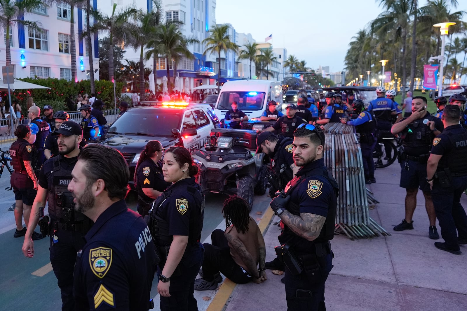 FILE - City of Miami Beach police officers respond to an incident during spring break, March 15, 2024, in Miami Beach, Fla. (AP Photo/Rebecca Blackwell, File)