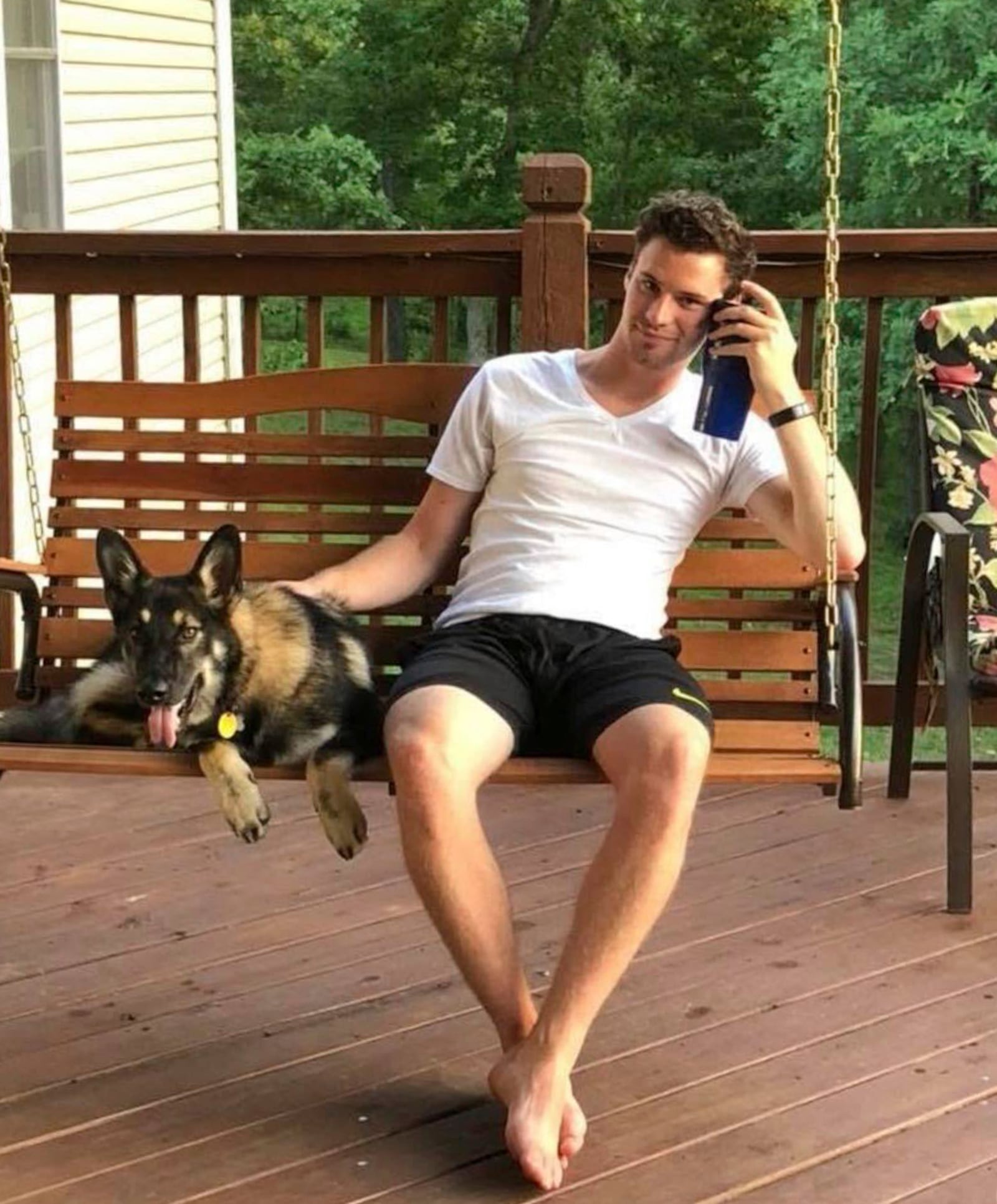 In this undated photo, Travis Timmerman sits on a porch swing in Urbana, Mo. (Stacey Gardiner via AP)