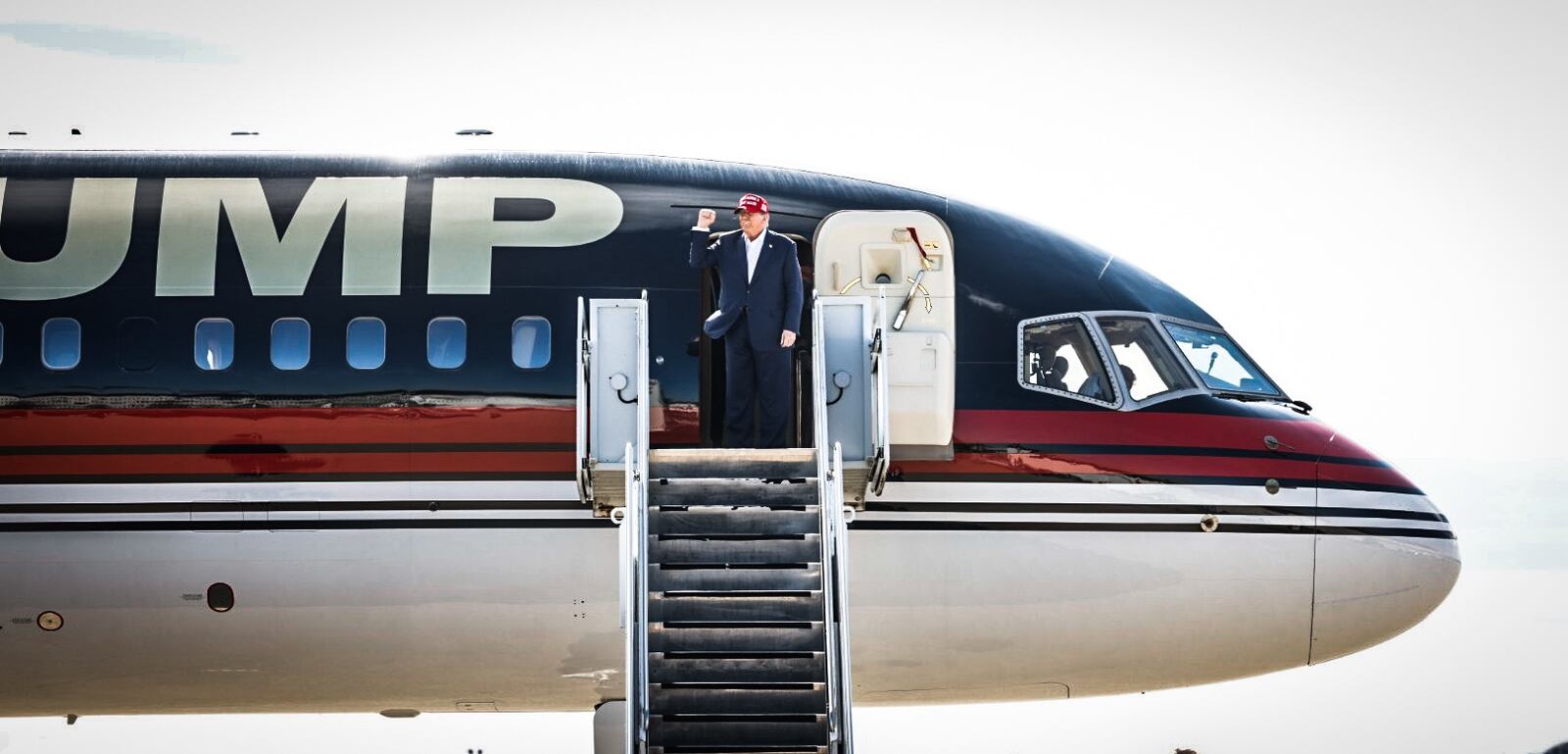 Republican presidential candidate Donald Trump steps off his plane at Wright Bros Aero Inc. for a rally in Dayton on March 16, 2024. Jim Noelker/Staff