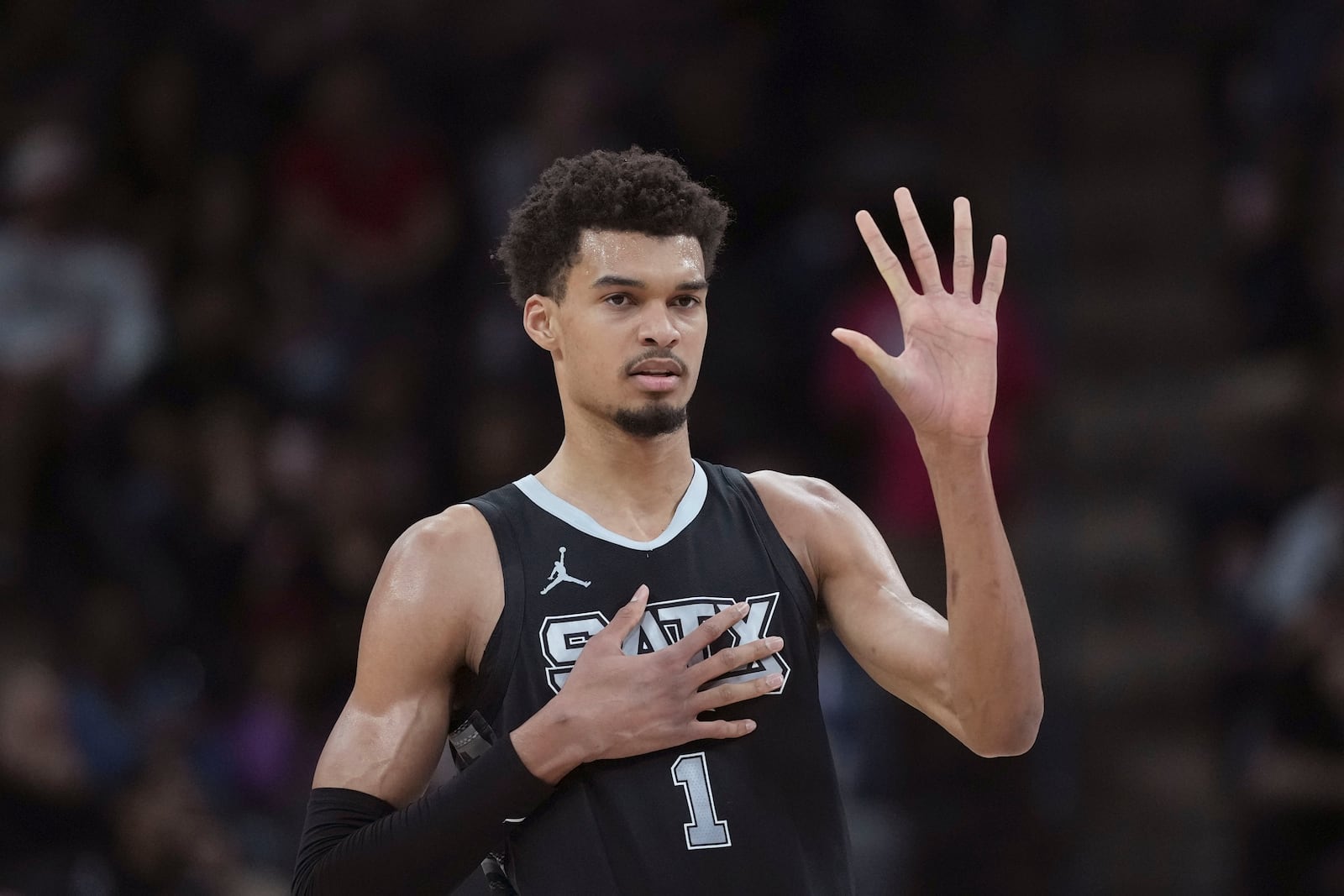 San Antonio Spurs center Victor Wembanyama calls a play during the first half of an NBA basketball game against the LA Clippers in San Antonio, Wednesday, Jan. 29, 2025. (AP Photo/Eric Gay)