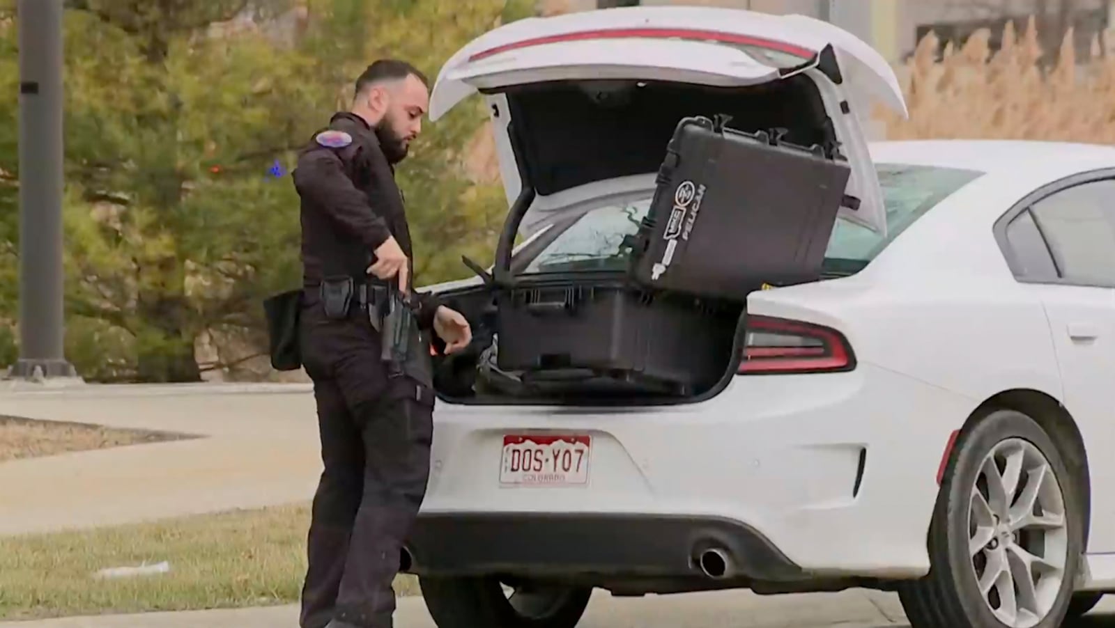 In this image taken from video provided by WXYZ-TV, law enforcement respond to a shooting at Corewell Health Beaumont Troy Hospital on Thursday, March 20, 2025, in Troy, Mich. (WXYZ-TV via AP)