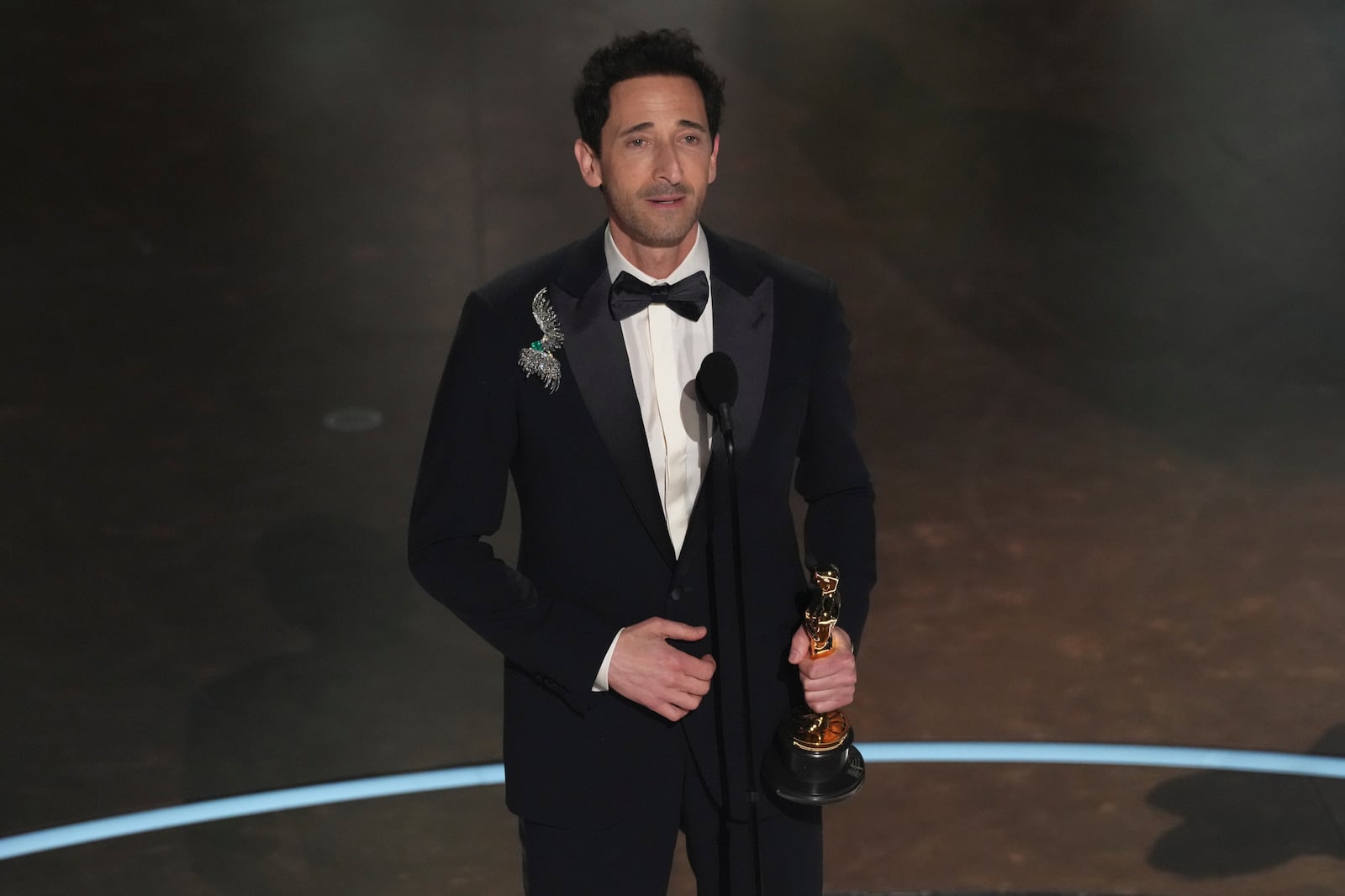 Adrien Brody accepts the award for best performance by an actor in a leading role for "The Brutalist" during the Oscars on Sunday, March 2, 2025, at the Dolby Theatre in Los Angeles. (AP Photo/Chris Pizzello)