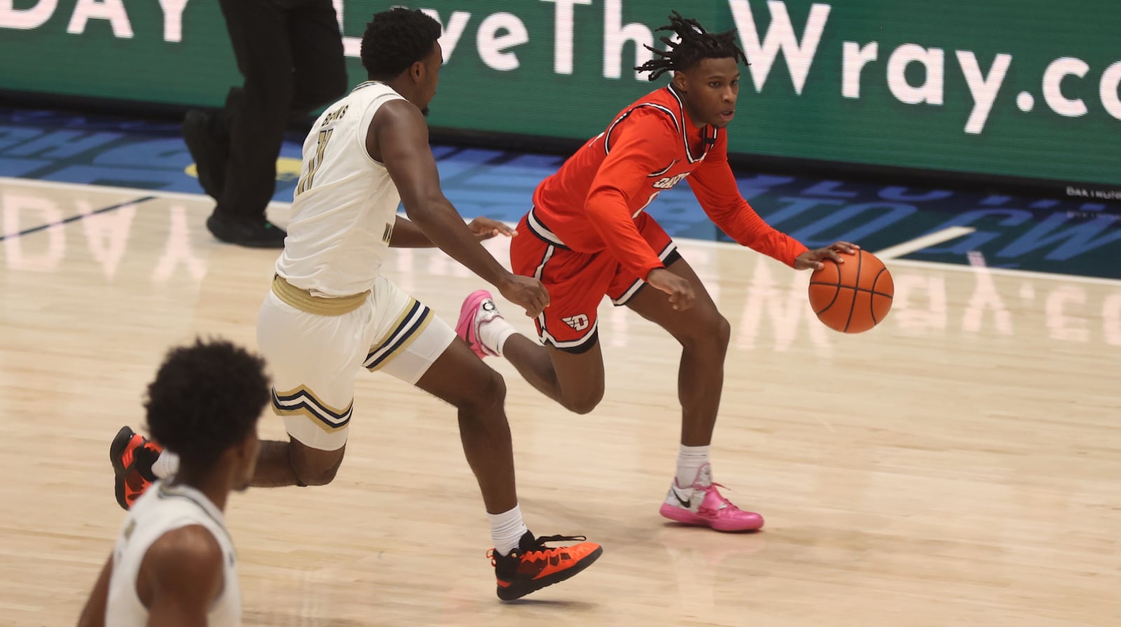 Dayton's Malachi Smith dribbles against George Washington on Saturday, Jan. 4, 2025, at the Charles E. Smith Center in Washington, D.C. David Jablonski/Staff