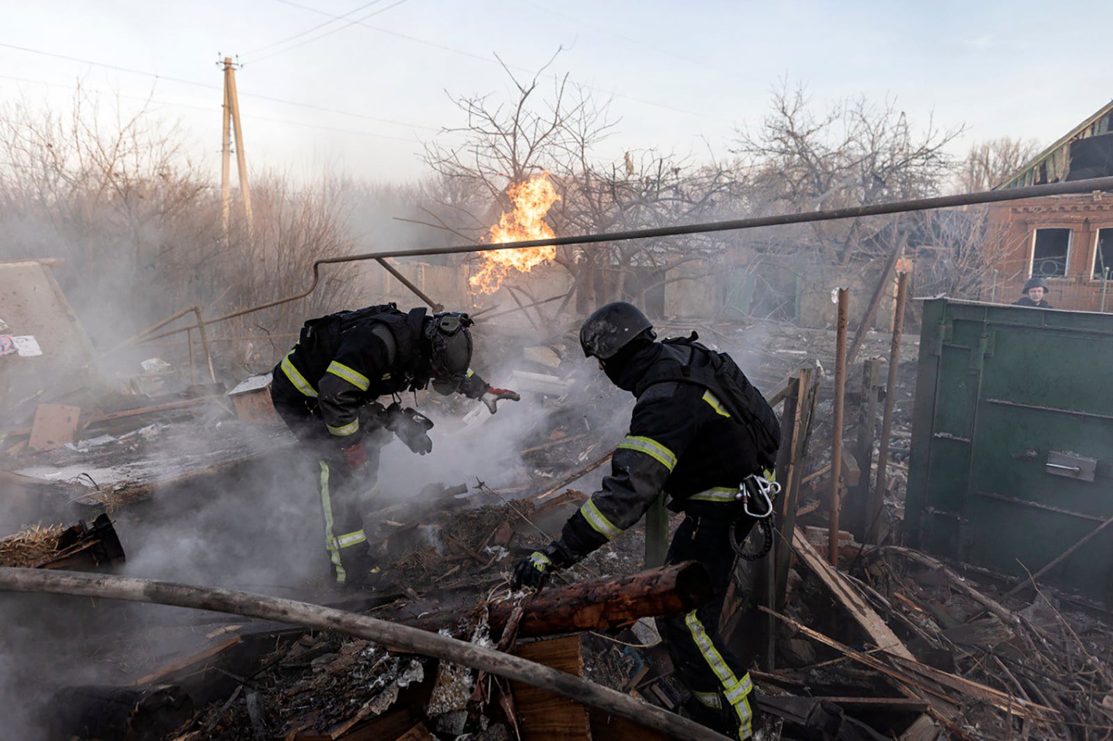 In this photo provided by the Ukrainian Emergency Service, firefighters put out the fire following a Russian air attack in Kostiantynivka, Donetsk region, Ukraine, Friday, March 7, 2025. (Ukrainian Emergency Service via AP)