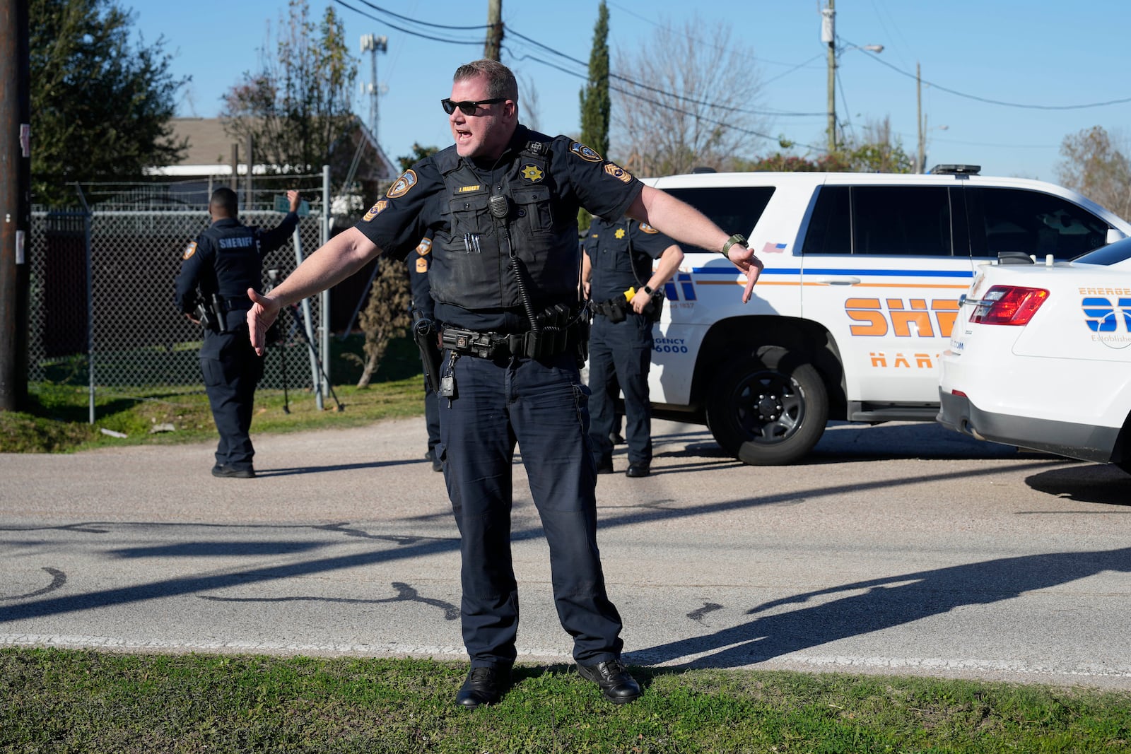 Harris County Sheriff's officers clear the media from the neighborhood where 42-year-old suspect Shamsud-Din Bahar Jabbar is believed to have lived, Wednesday, Jan. 1, 2025, in Houston, after a pickup truck rammed into a crowd of New Orleans revelers on Bourbon Street early on New Year's Day. (AP Photo/David J. Phillip)