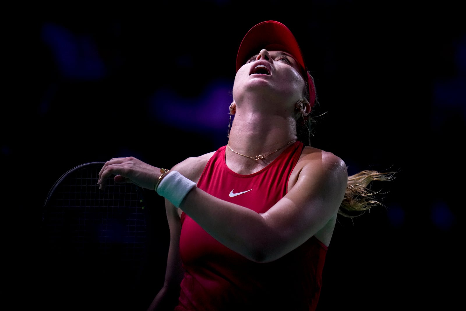 Spain's Paula Badosa reacts as she plays Poland's Iga Swiatek during the Billie Jean King Cup Finals, at the Martin Carpena Sports Hall, in Malaga, southern Spain, on Friday, Nov. 15, 2024. (AP Photo/Manu Fernandez)