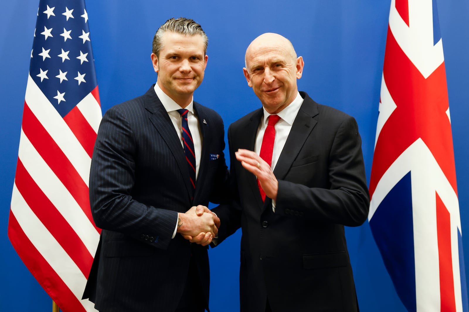 United States Secretary of Defense Pete Hegseth, left, shakes hands with Britain's Defense Secretary John Healey prior to a bilateral meeting on the sidelines of a NATO defense ministers meeting at NATO headquarters in Brussels, Wednesday, Feb. 12, 2025. (Johanna Geron, Pool Photo via AP)