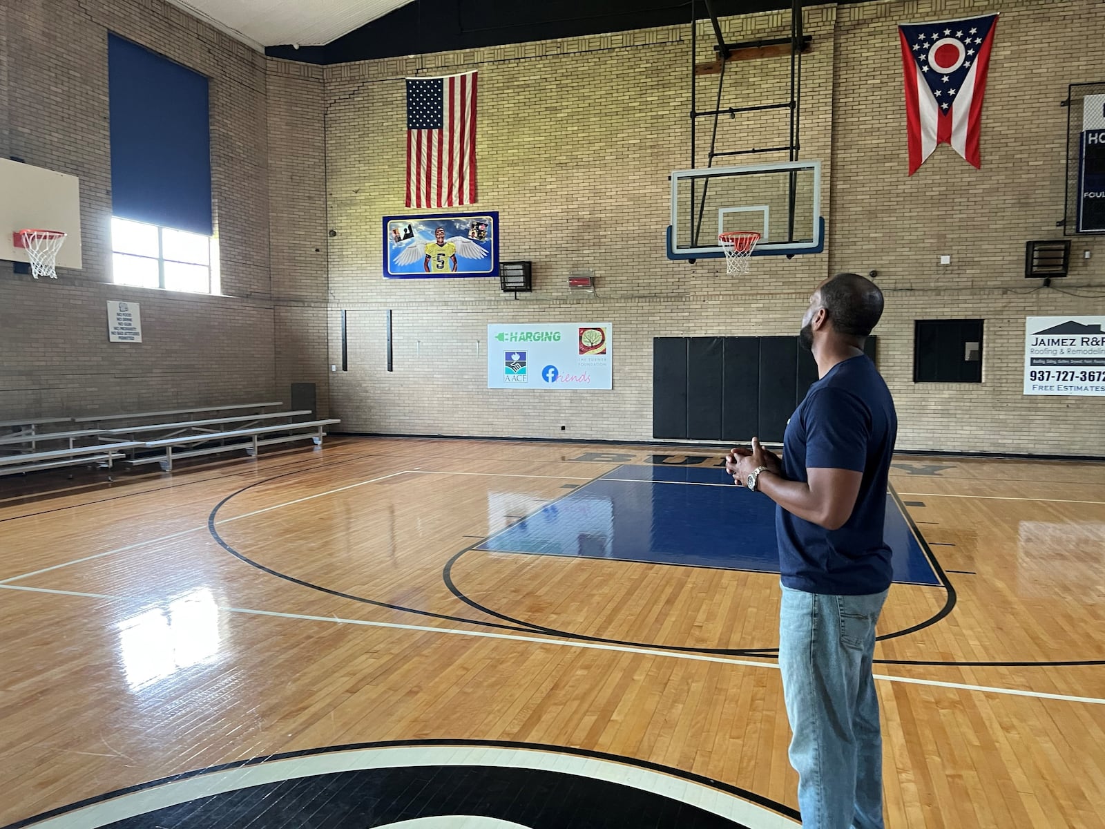 Springfield native and former basketball star James Cooper stands in the gymnasium of a former community school on South Wittenberg Avenue. That space will serve as the new location for Cooper's program that aims to provide sports training, mental health services and other activities for area youth. Hasan Karim/Staff